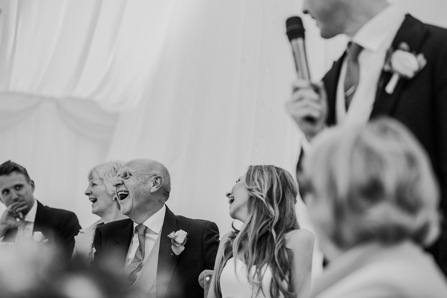 BW photo during grooms speech