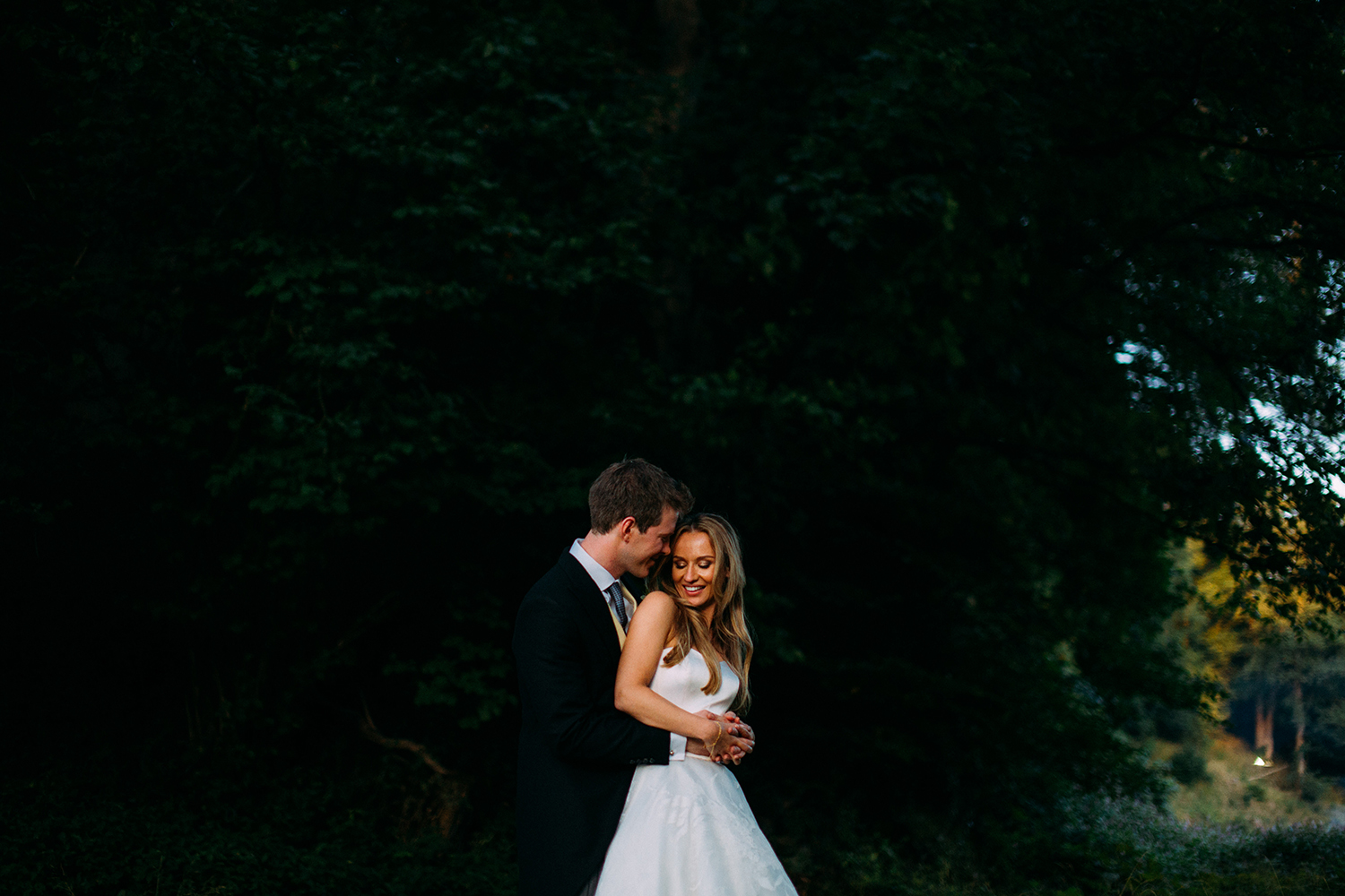 bride and groom embrace