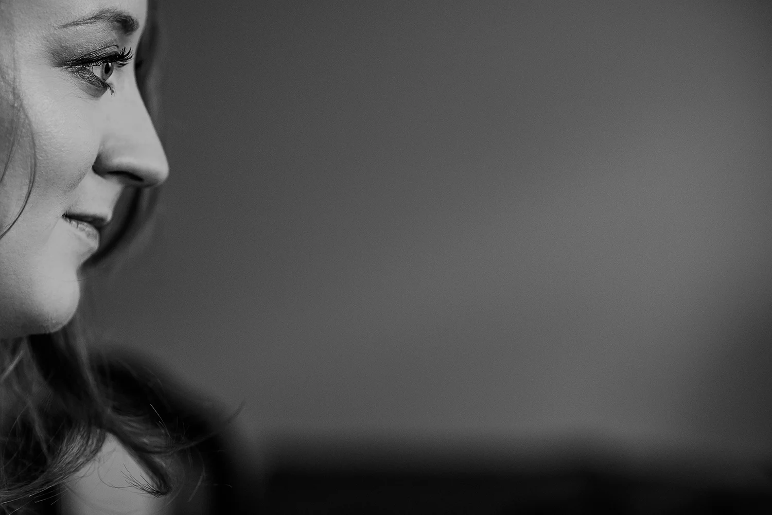 BW photo close up of bride having hair done