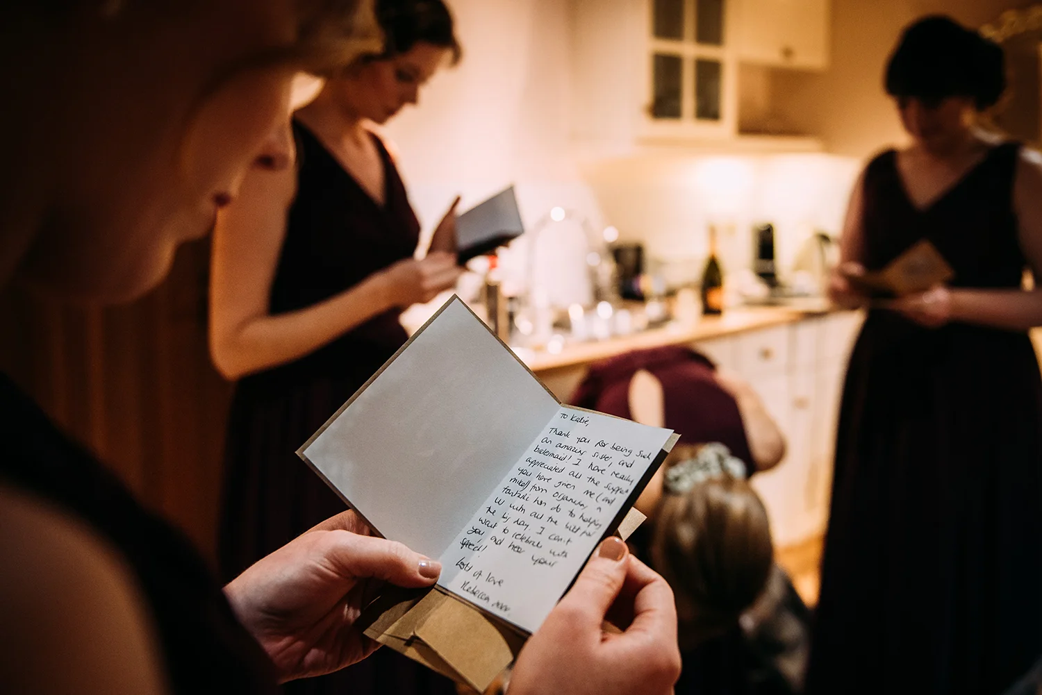 bridesmaids reading cards from the bride