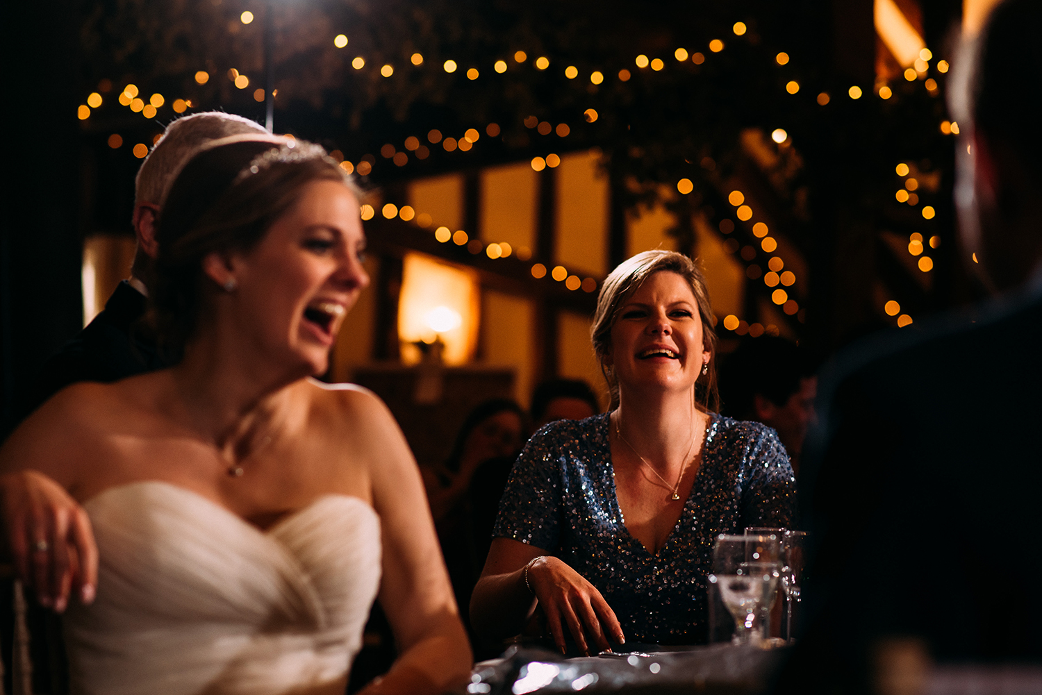 bride and sister laughing