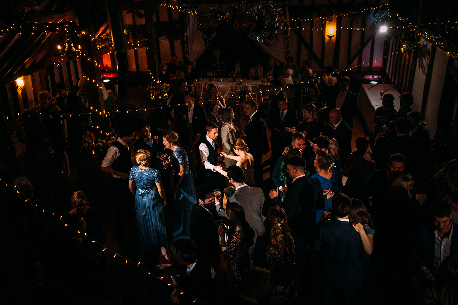 aerial shot of the full dance floor taken from the balcony with focus on the bride and groom