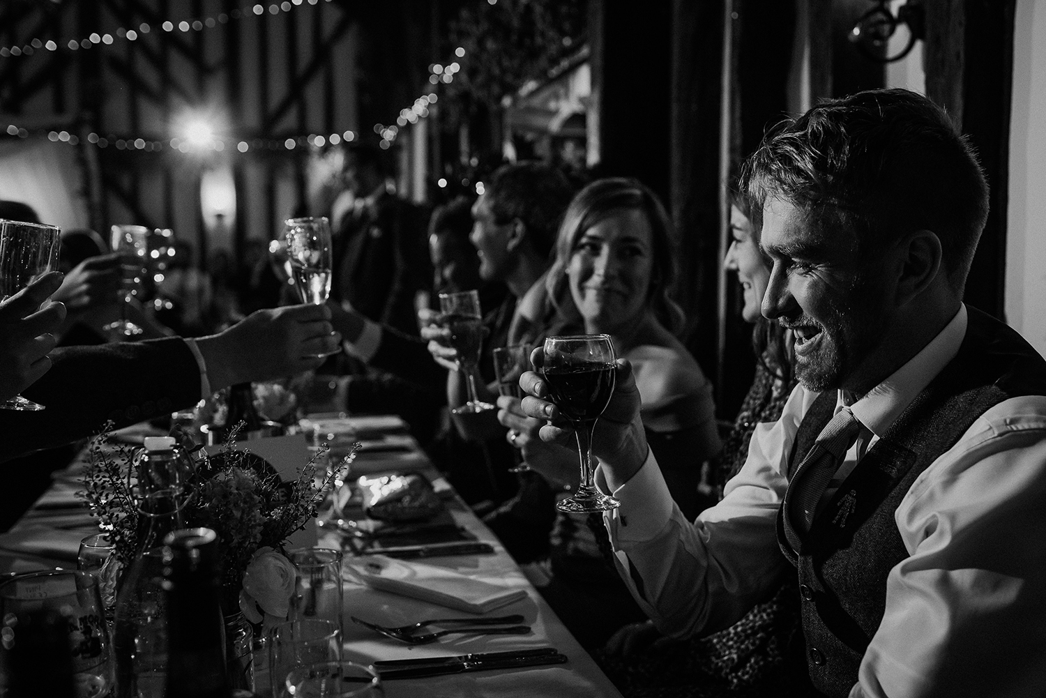 bw speech photo from the end of a long table