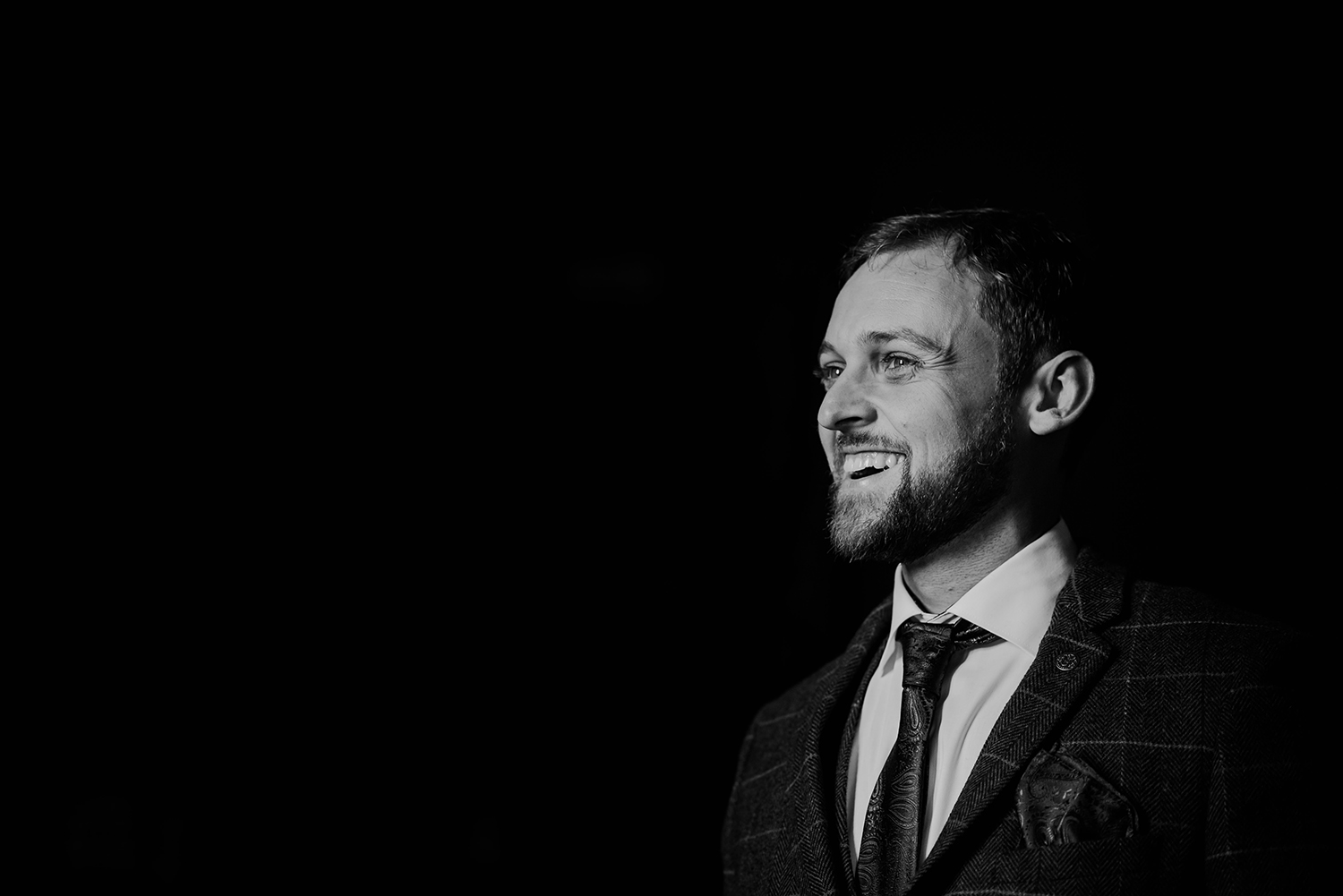 bw photo of the groom