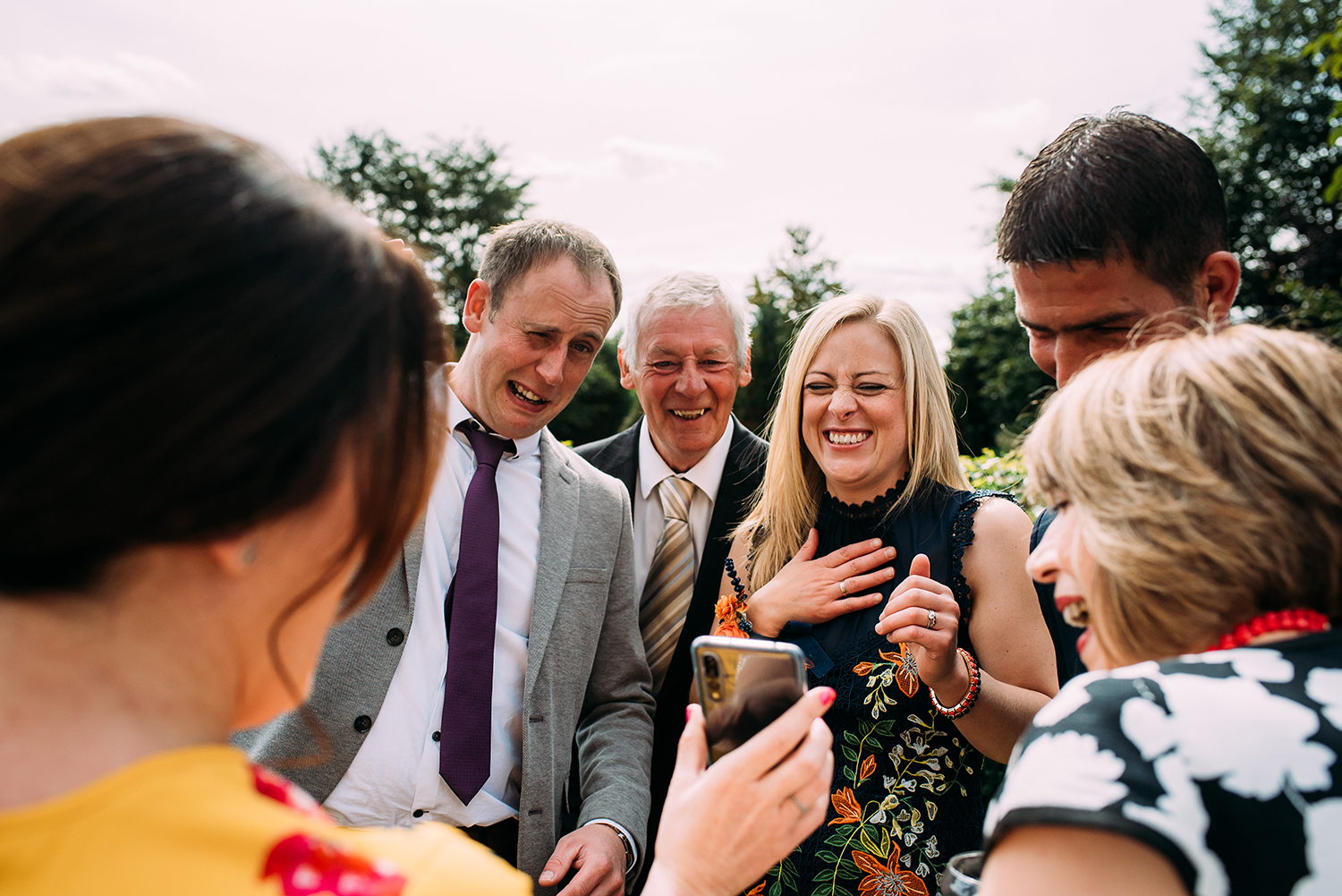 guests looking at something on a guests phone