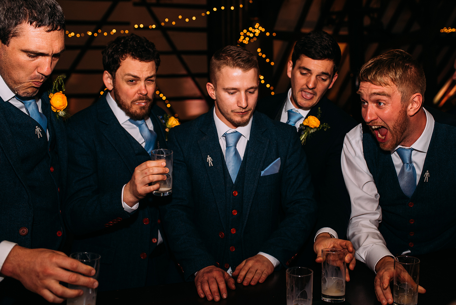 groomsmen doing shots at the bar