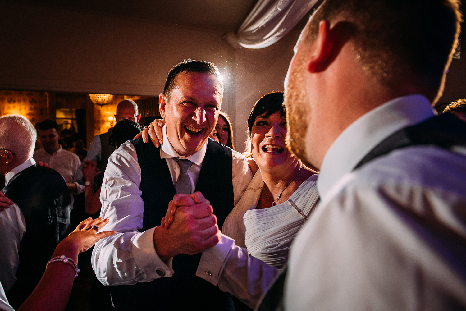 brides father shakes hands with the groom