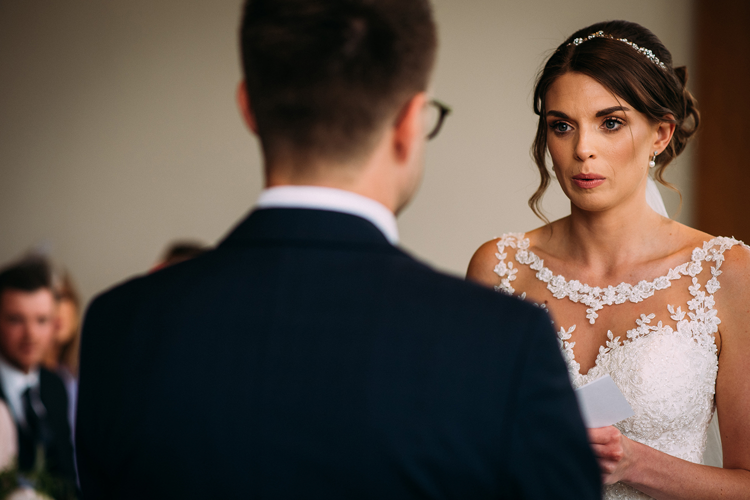 nervous bride takes a breath during the vows