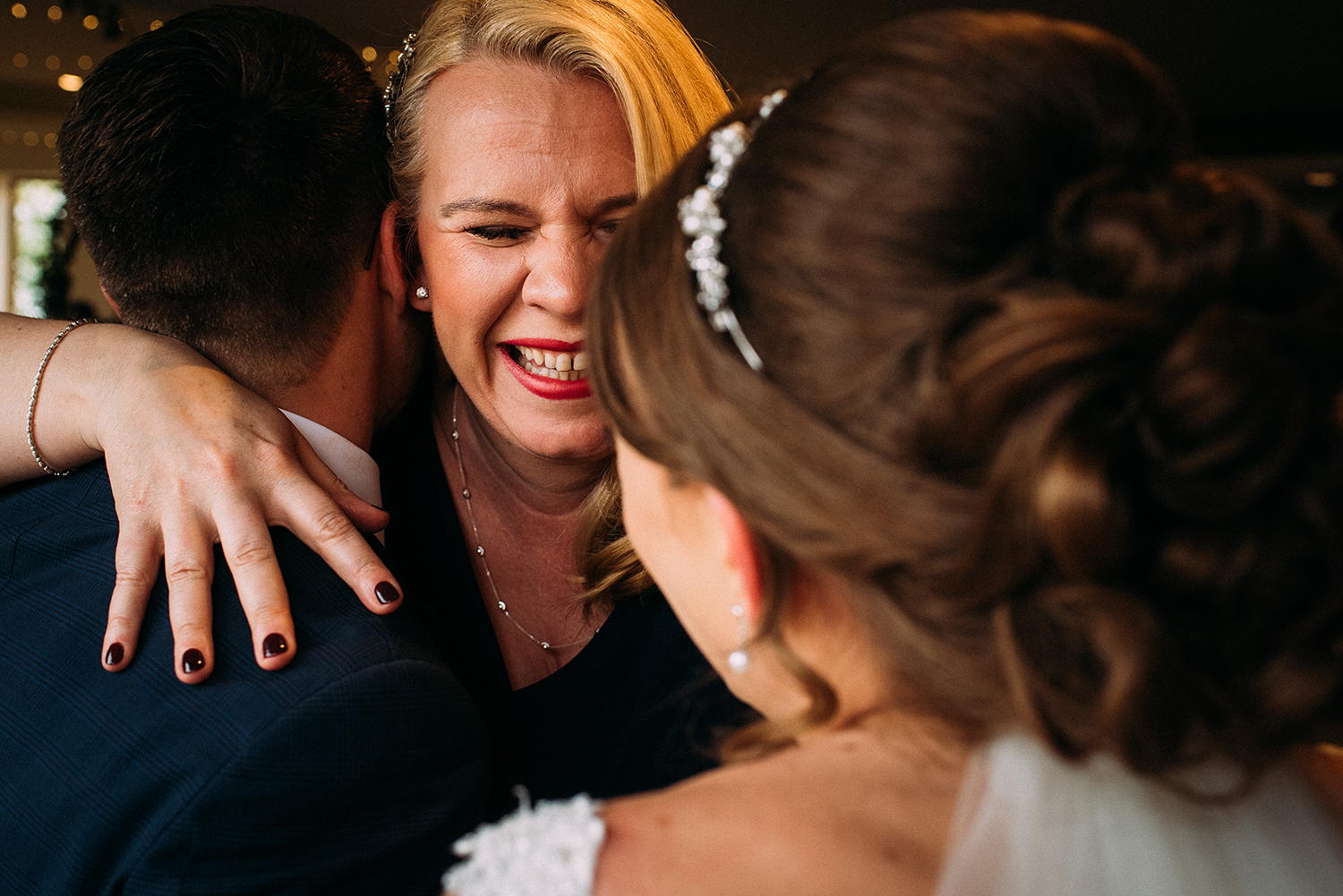 guest congratulates the bride and groom after the service