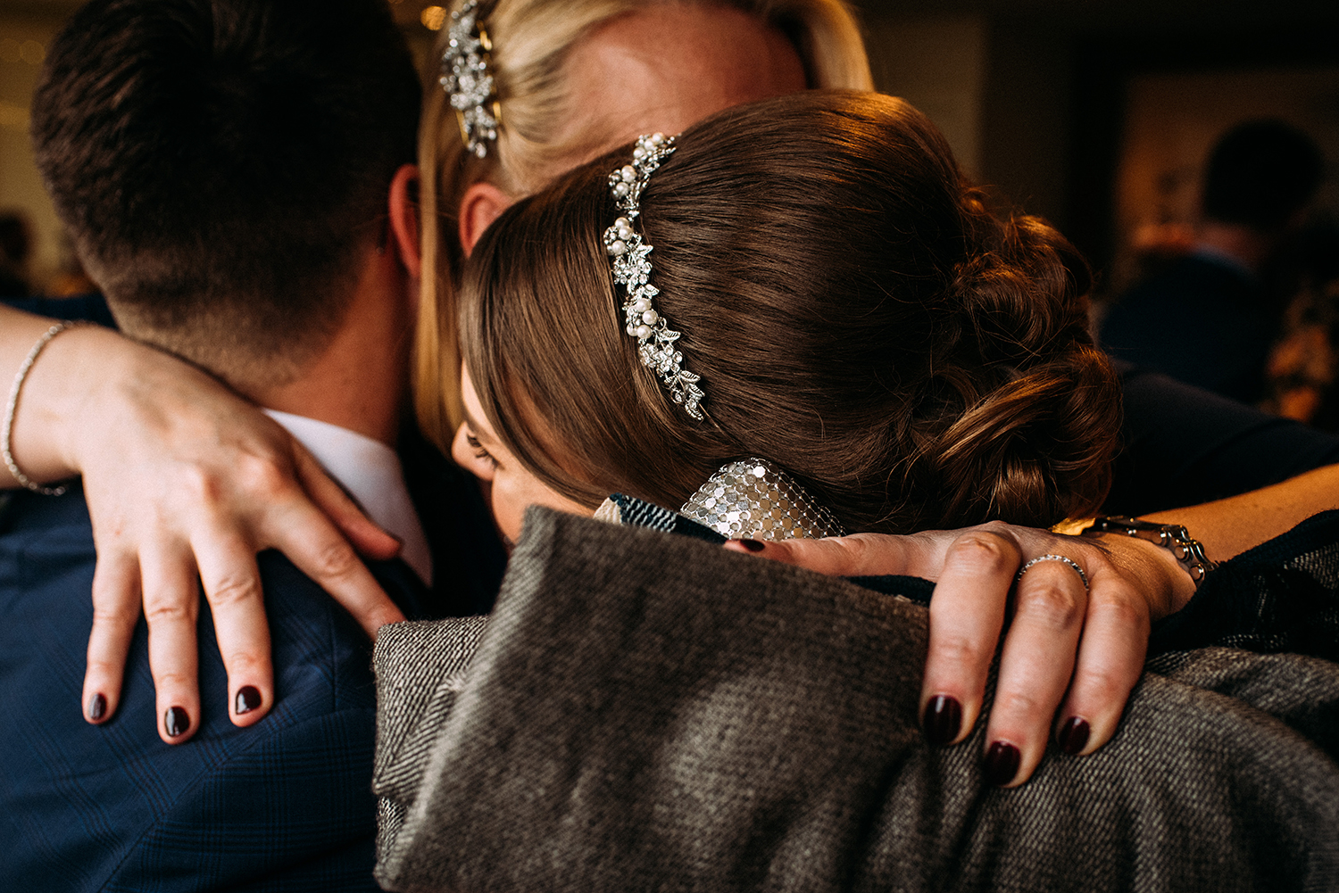 guest congratulates the bride and groom after the service