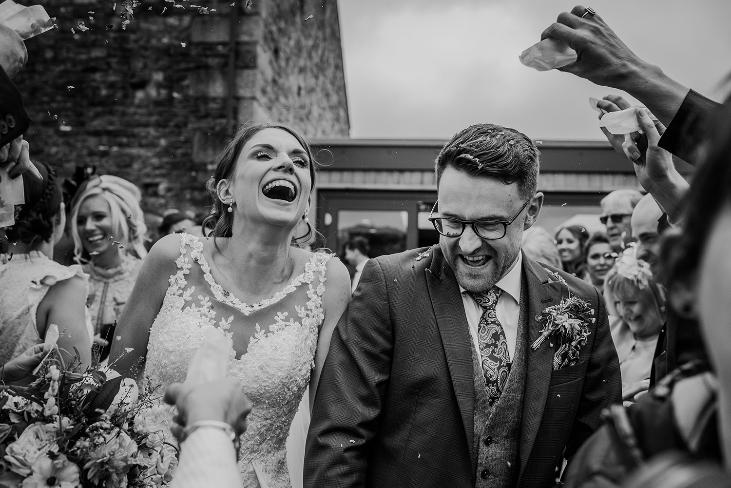 confetti on the bride and groom at the Out barn. BW photo