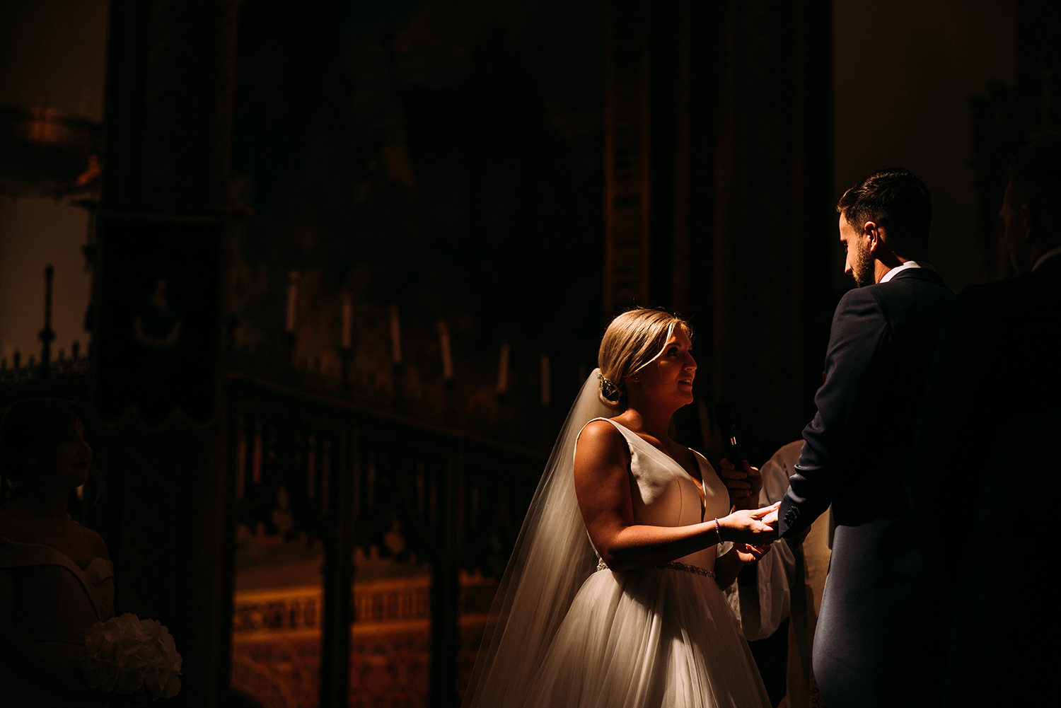 bride and groom in amazing light at church