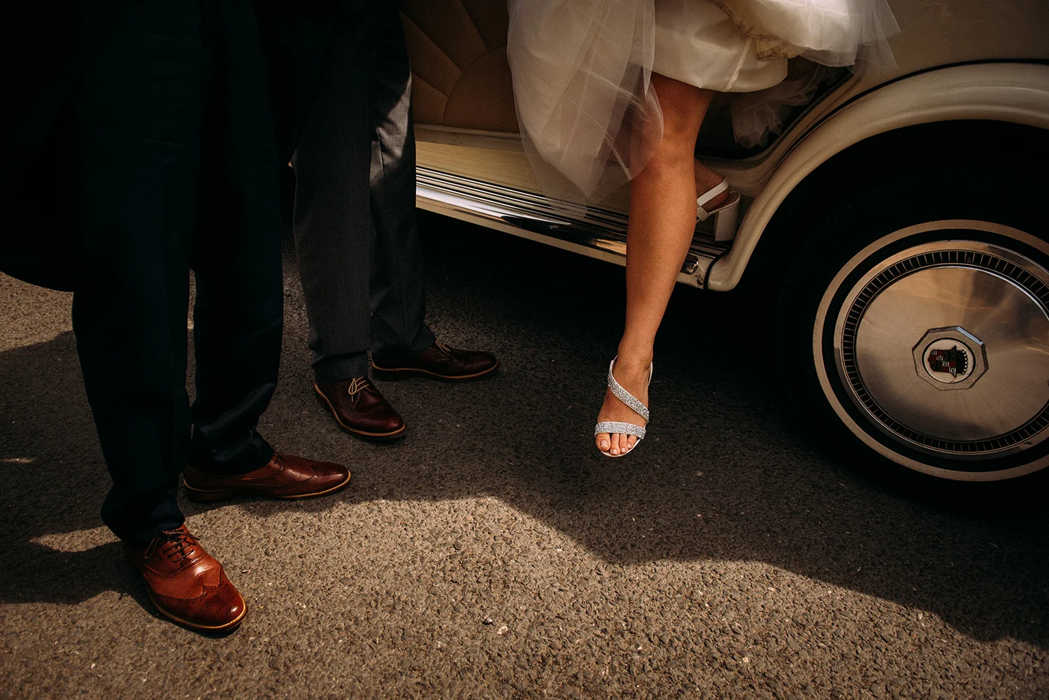 brides foot stepping out of the car