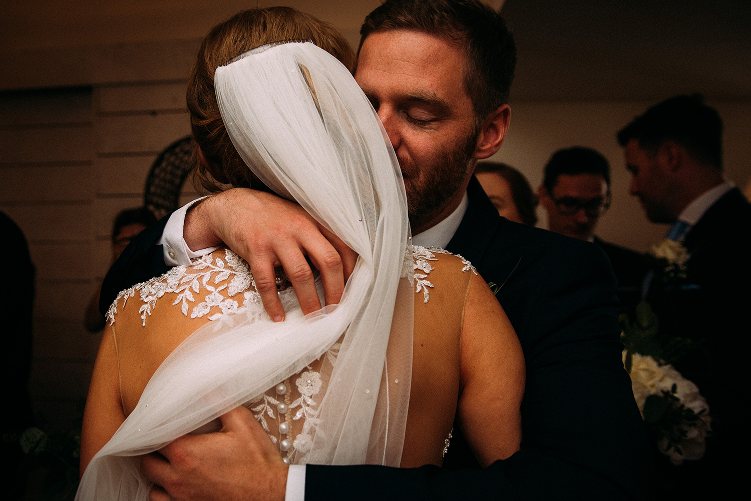 Guest hugs the bride