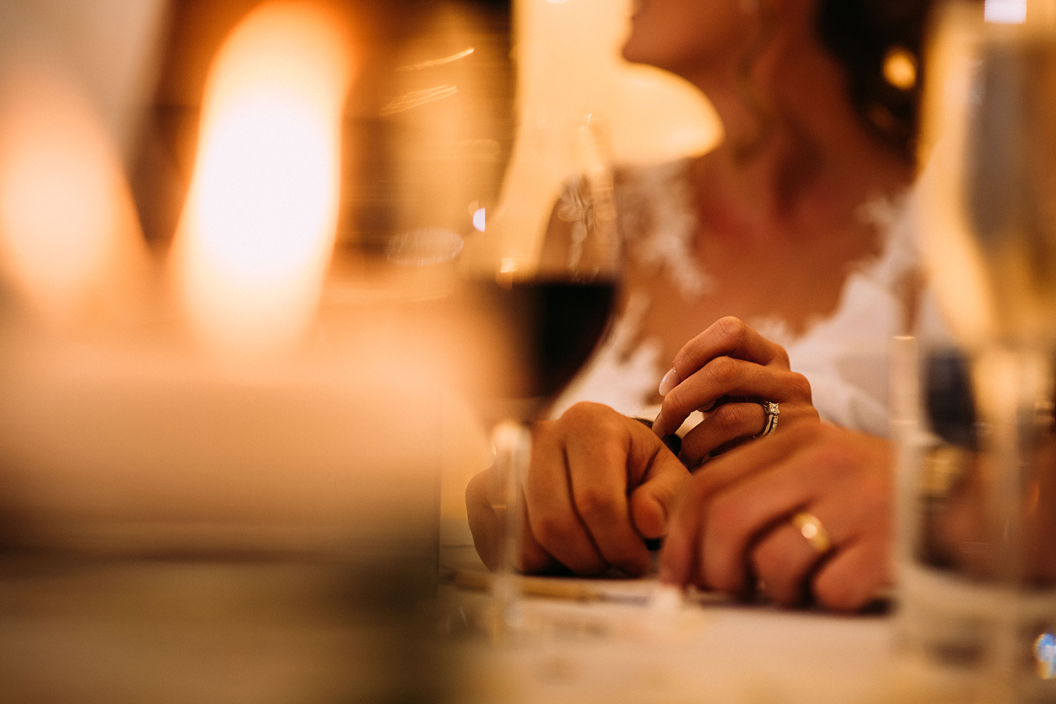 close-up of bride and groom holding hands at Bashall Barn