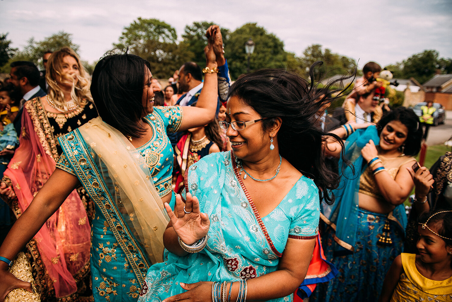  guests dancing during the groom procession 