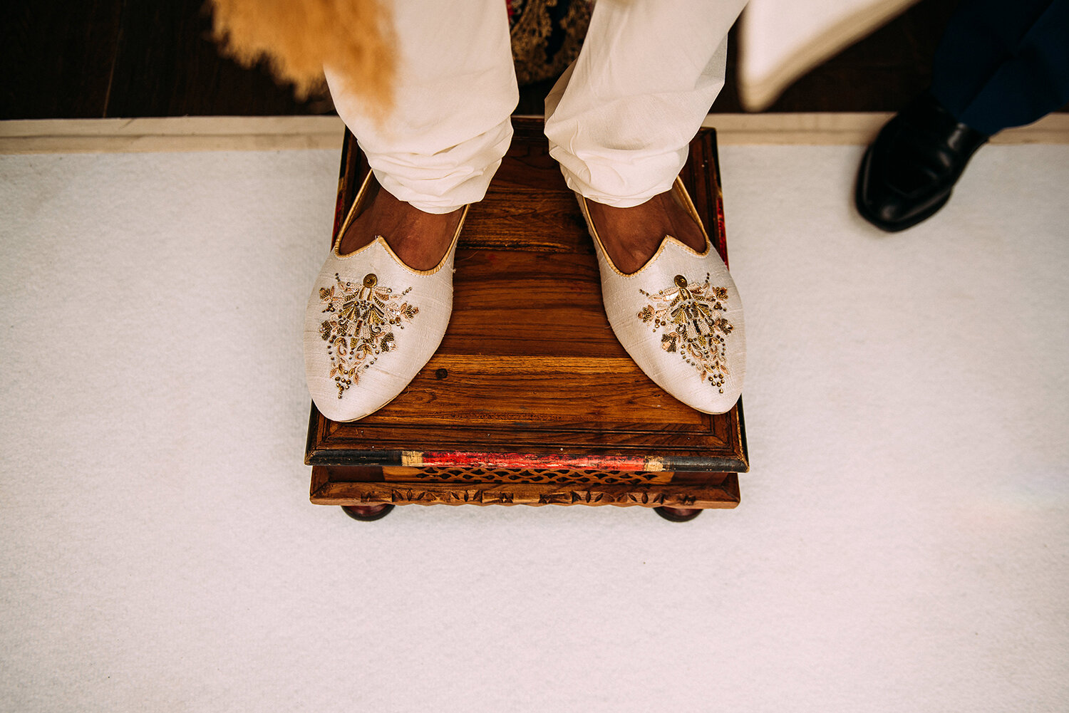  grooms shoes as he waits to enter the ceremony 