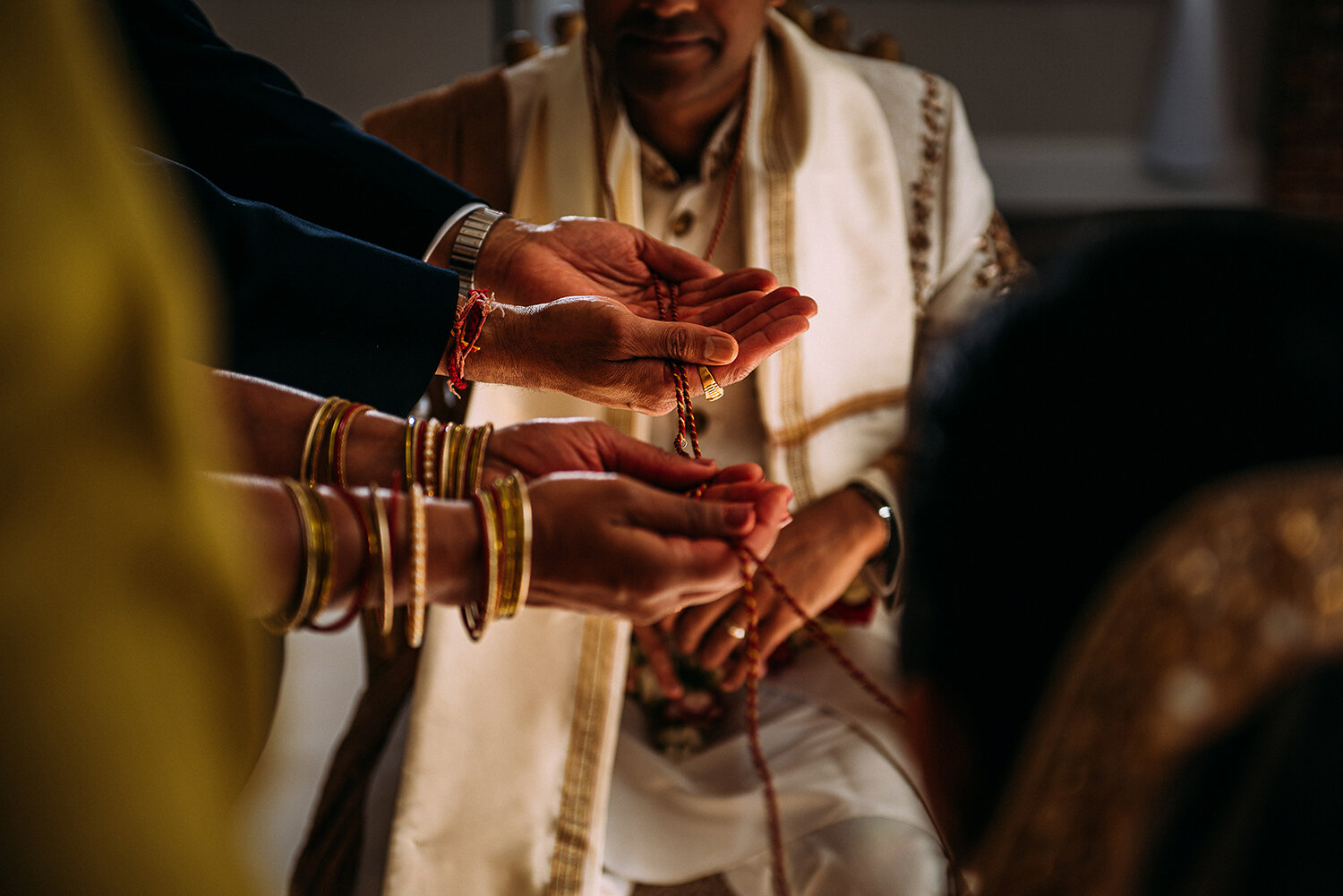  hands preparing the Mangala Sutra 