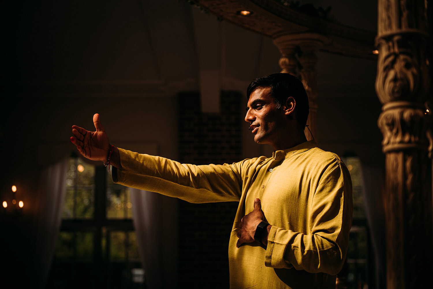  great light on the Indian priest as he raises an arm 