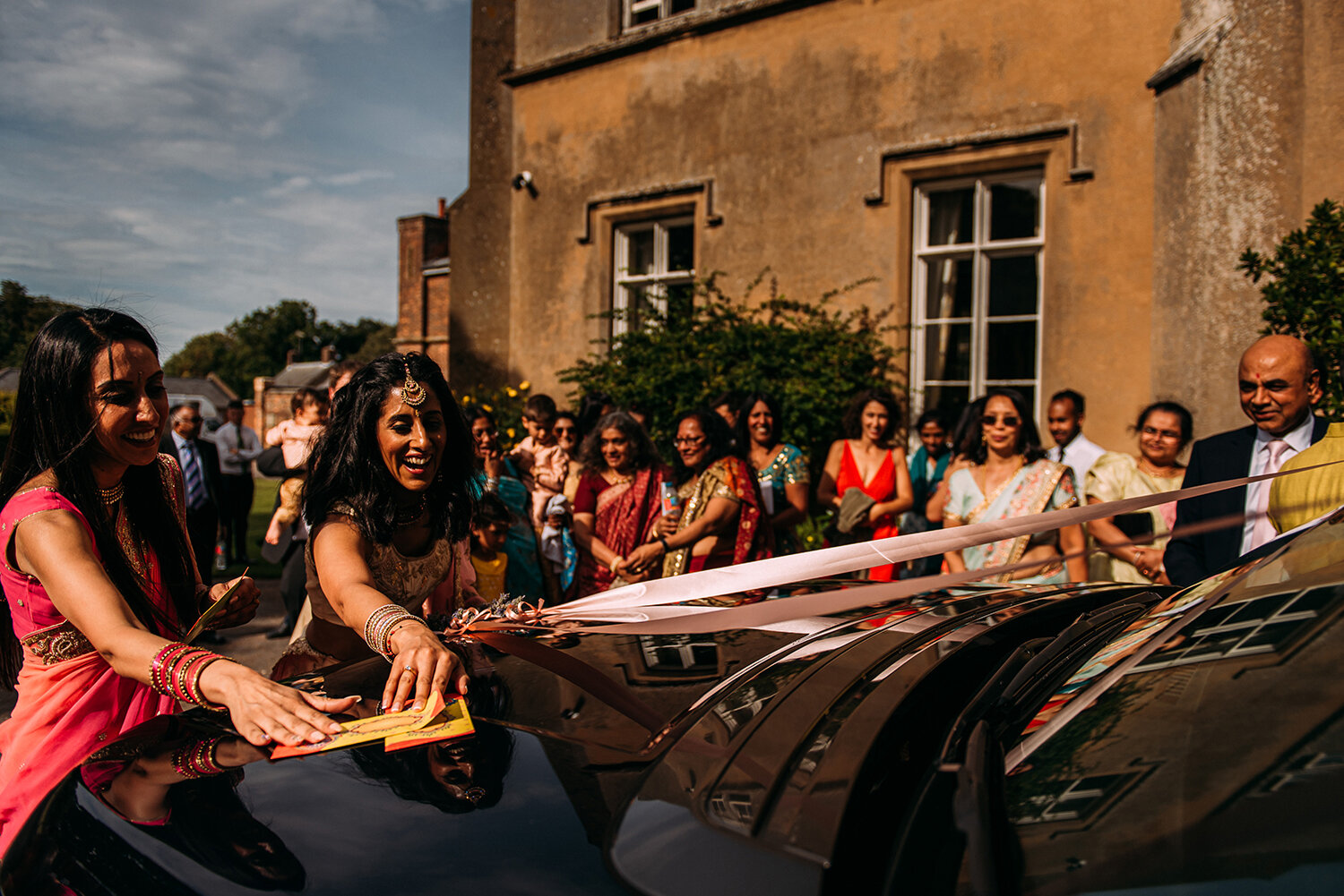  tradition of wedding guests stopping the bride and grooms car from leaving 