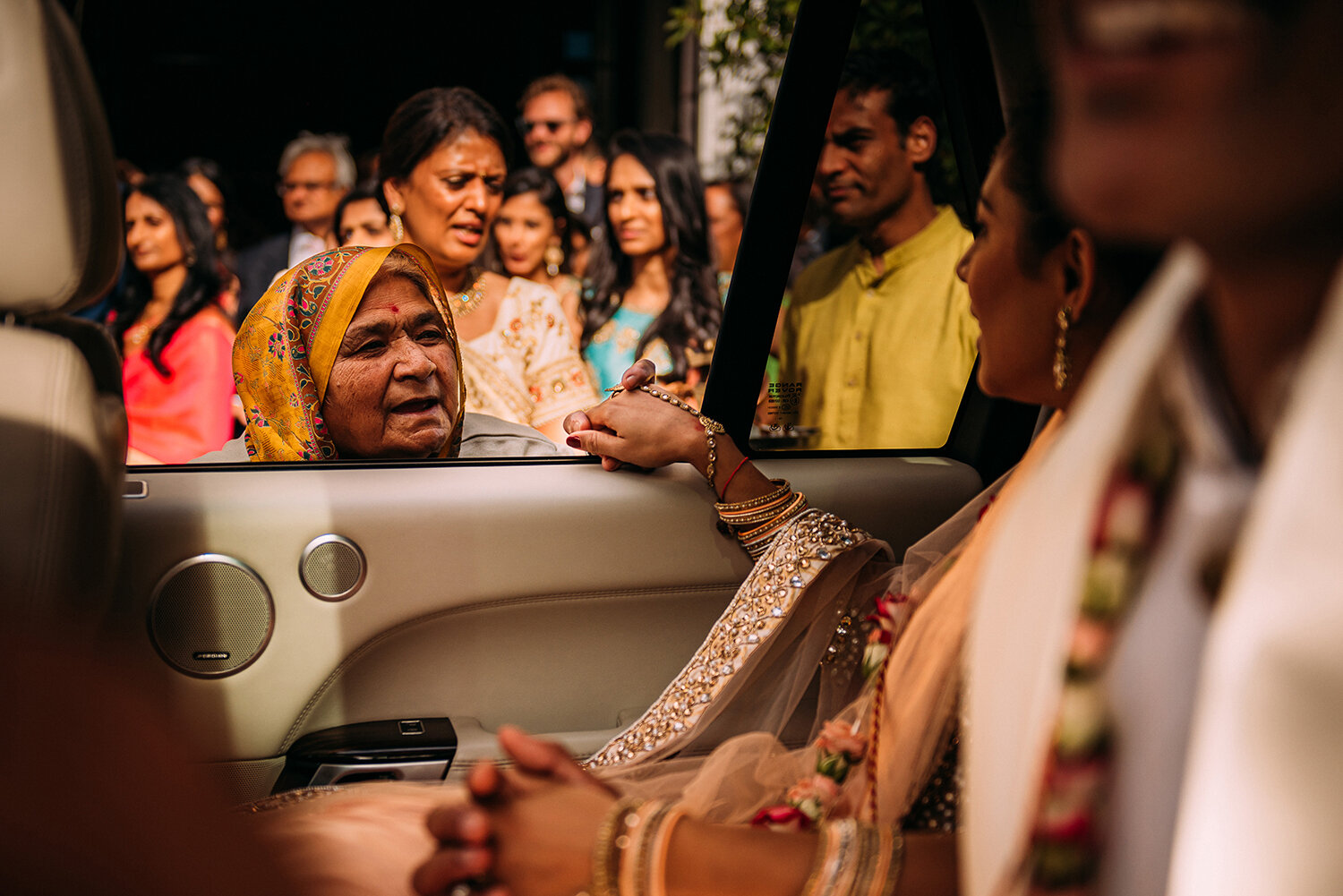  elderly relative holding the brides hand through the car window, and emotional ‘farewell’ 
