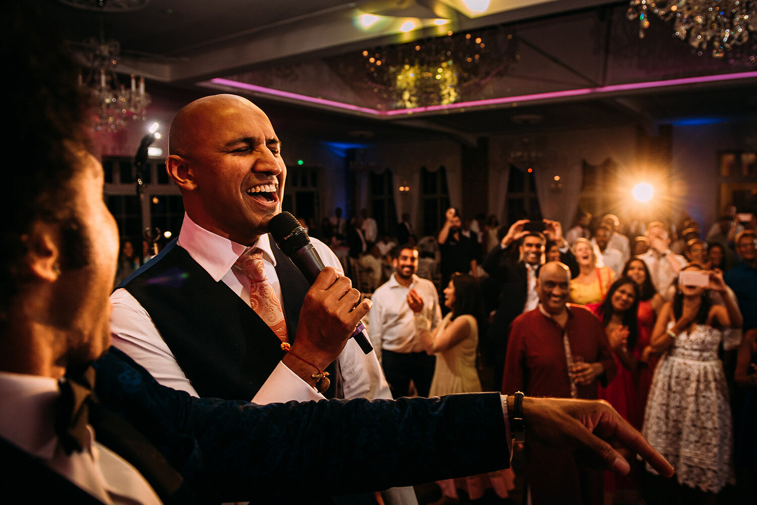  groom singing to the bride on stage 