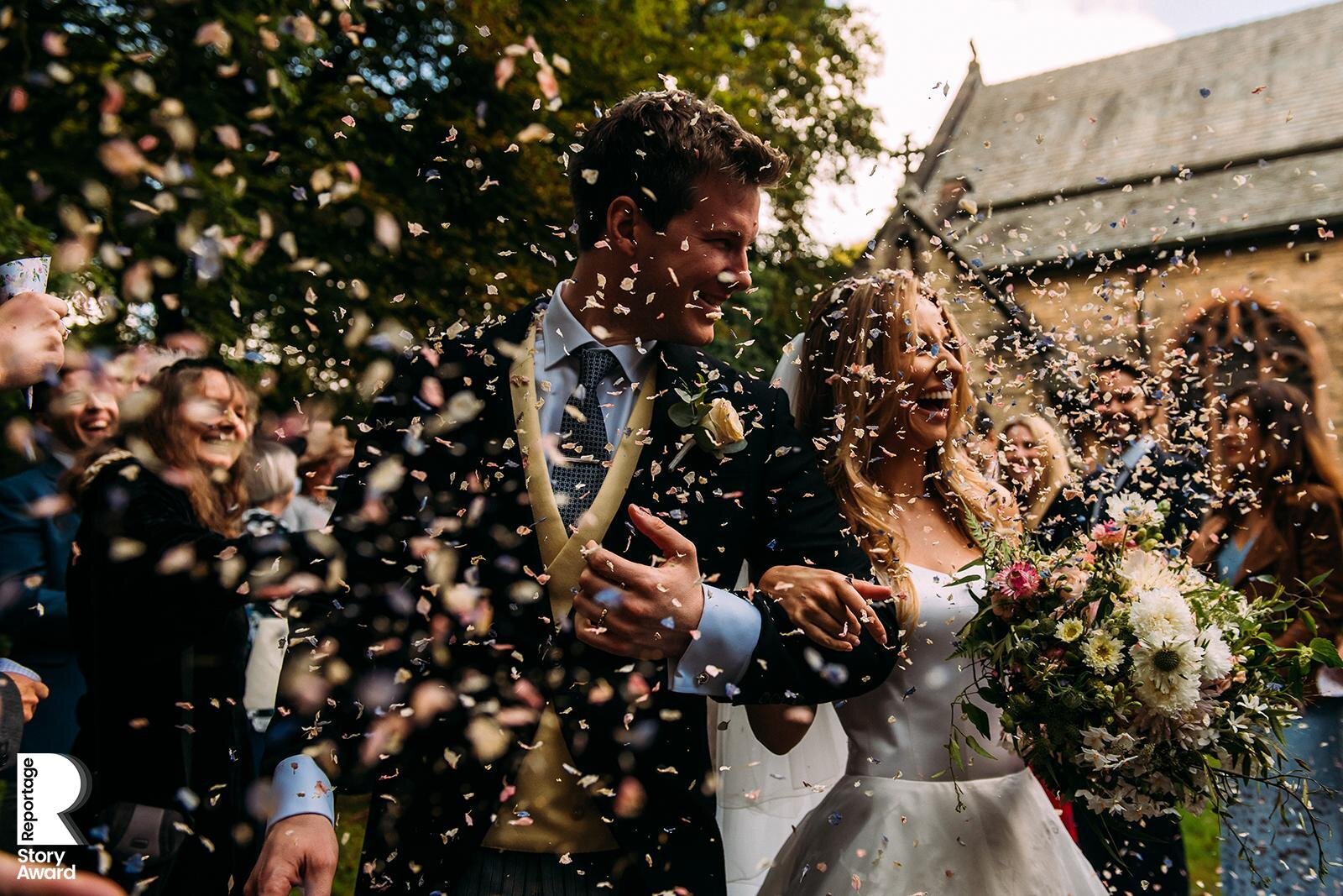  bride and groom walking through confetti 