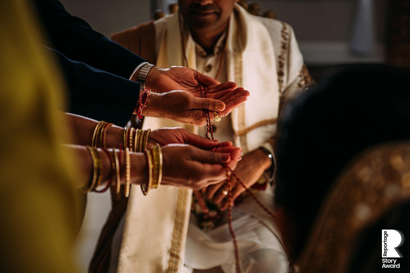 Beads on hands during the wedding ceremony 