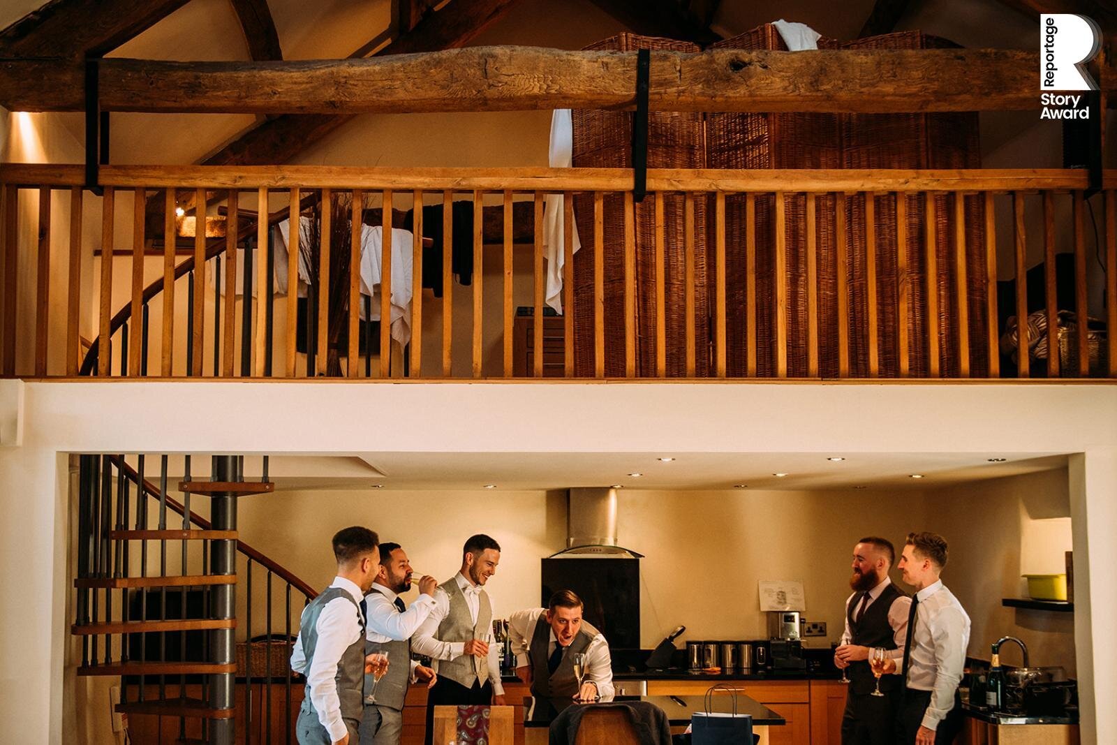  Groom and his friends laughing while getting ready. 