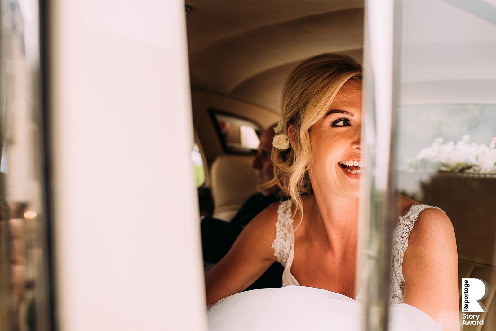  Bride looking excitedly out of the wedding car. 