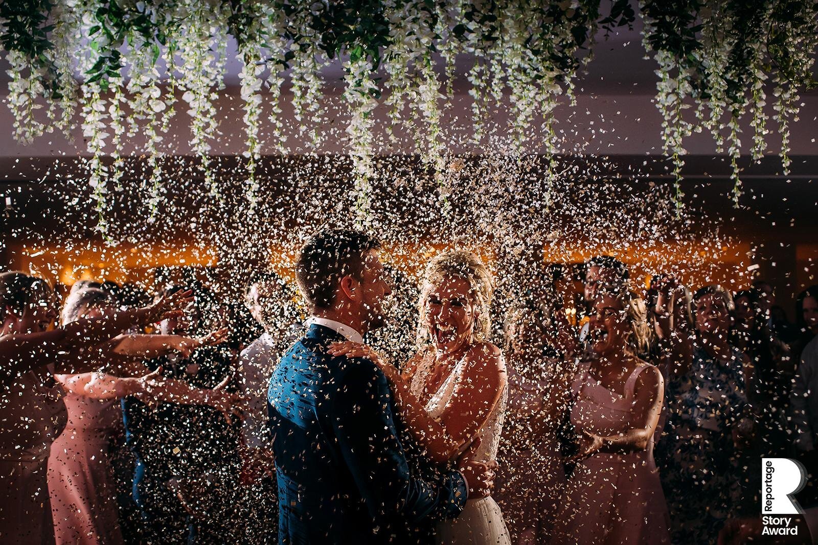  Bridesmaids throw confetti on the couple during their first dance. 