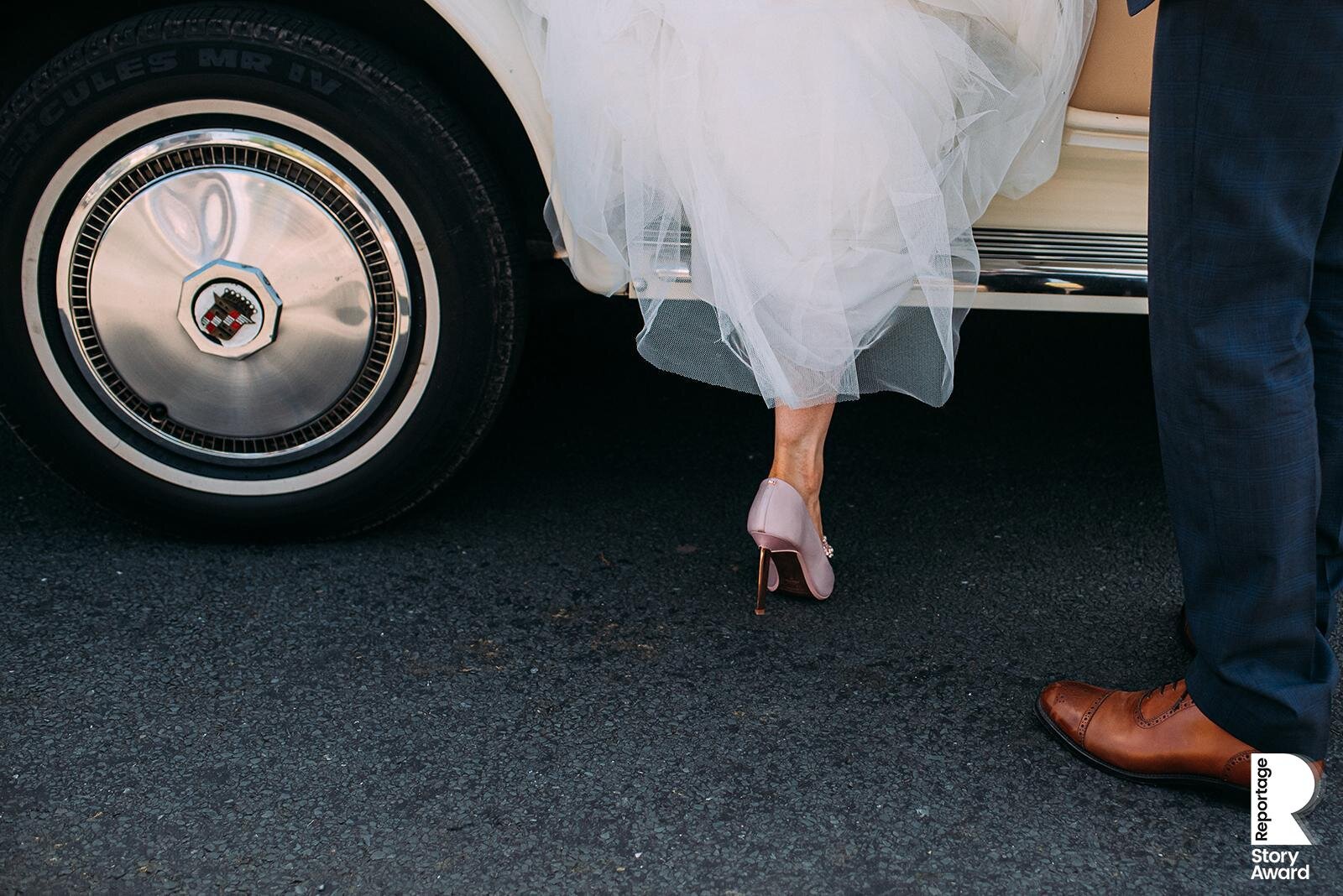  Brides shoe stepping out of the wedding car. 