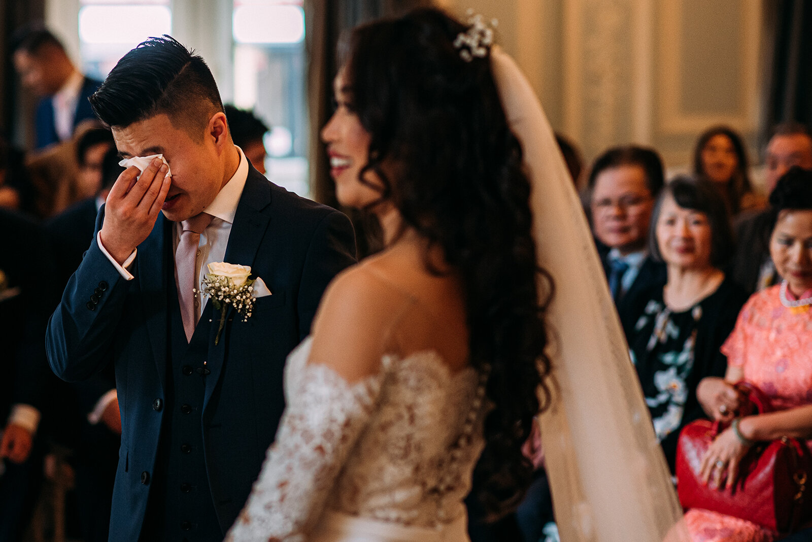 Groom wiping tears