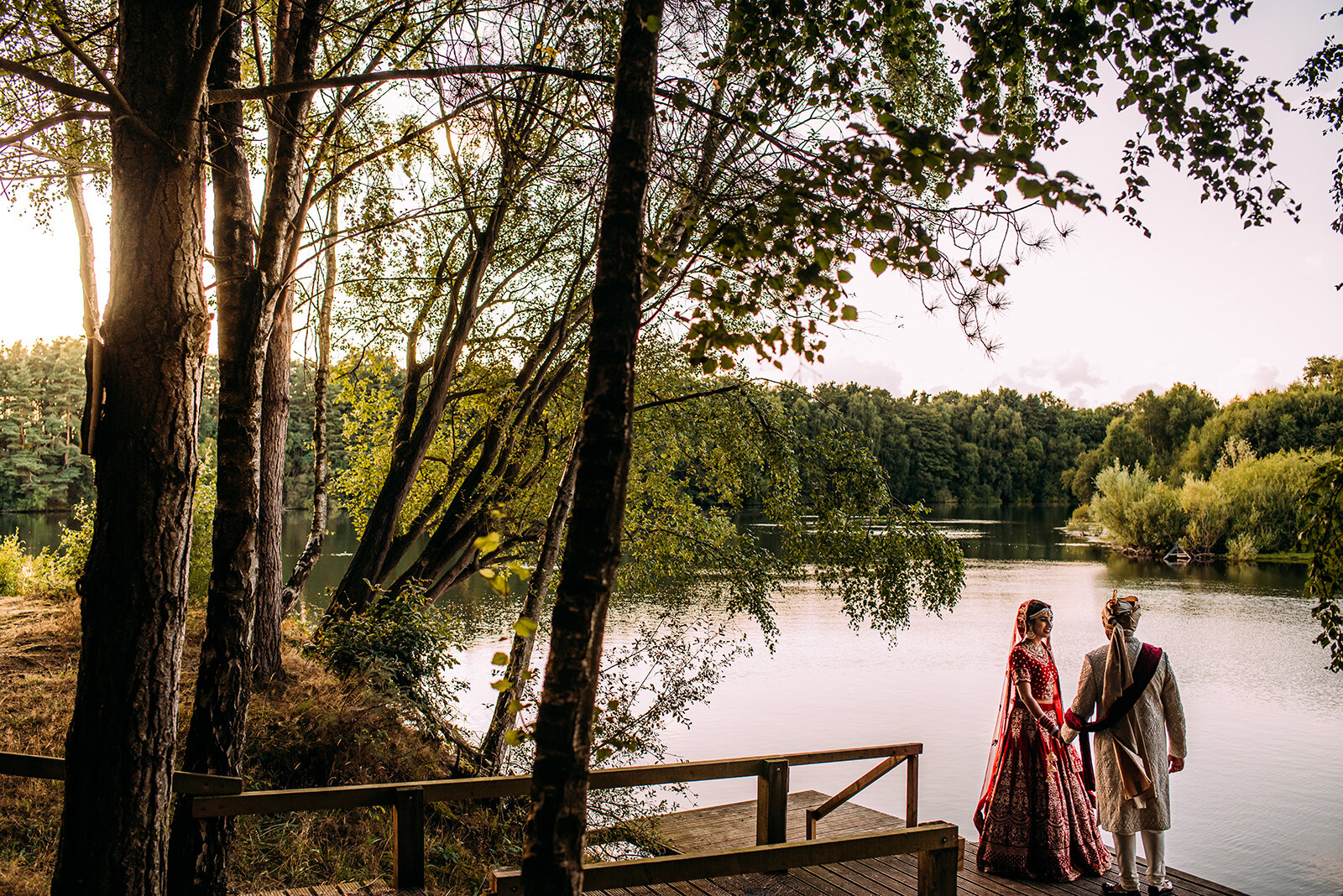  Bride and groom portraits in the woods by the lake at Nunsmere. 