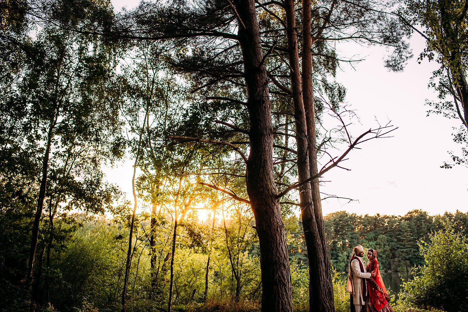  Bride and groom portraits in the woods by the lake at Nunsmere. 