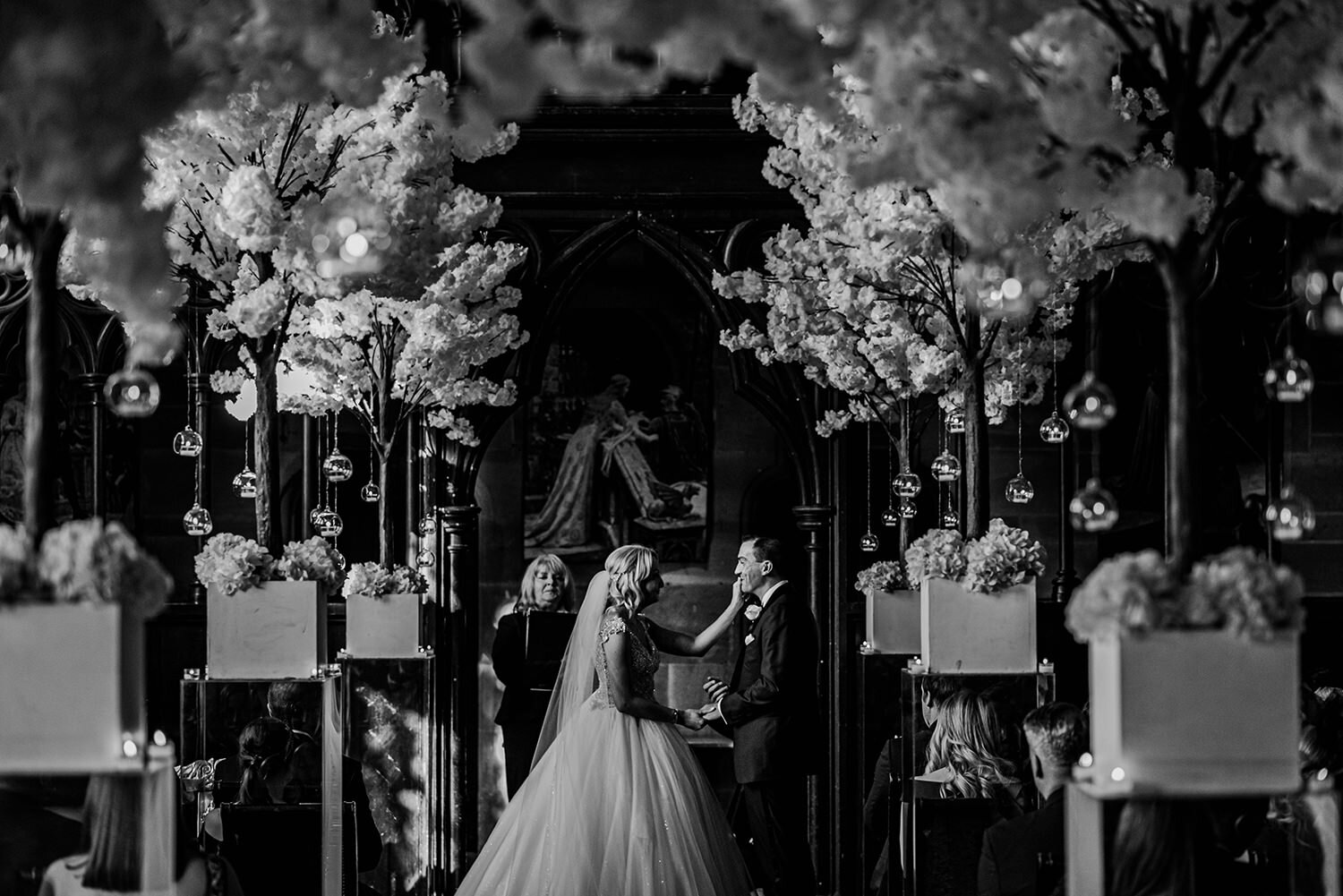  bride touches husbands face during the ceremony. 