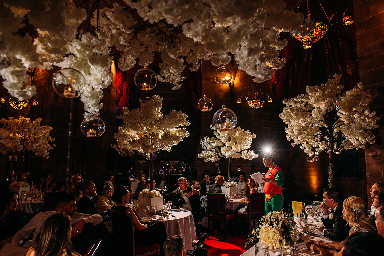  Wide shot of best man dressed as Robin from Batman during speech. 