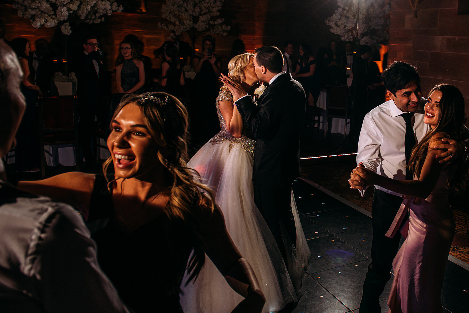  Bride and groom kiss on the dance floor 