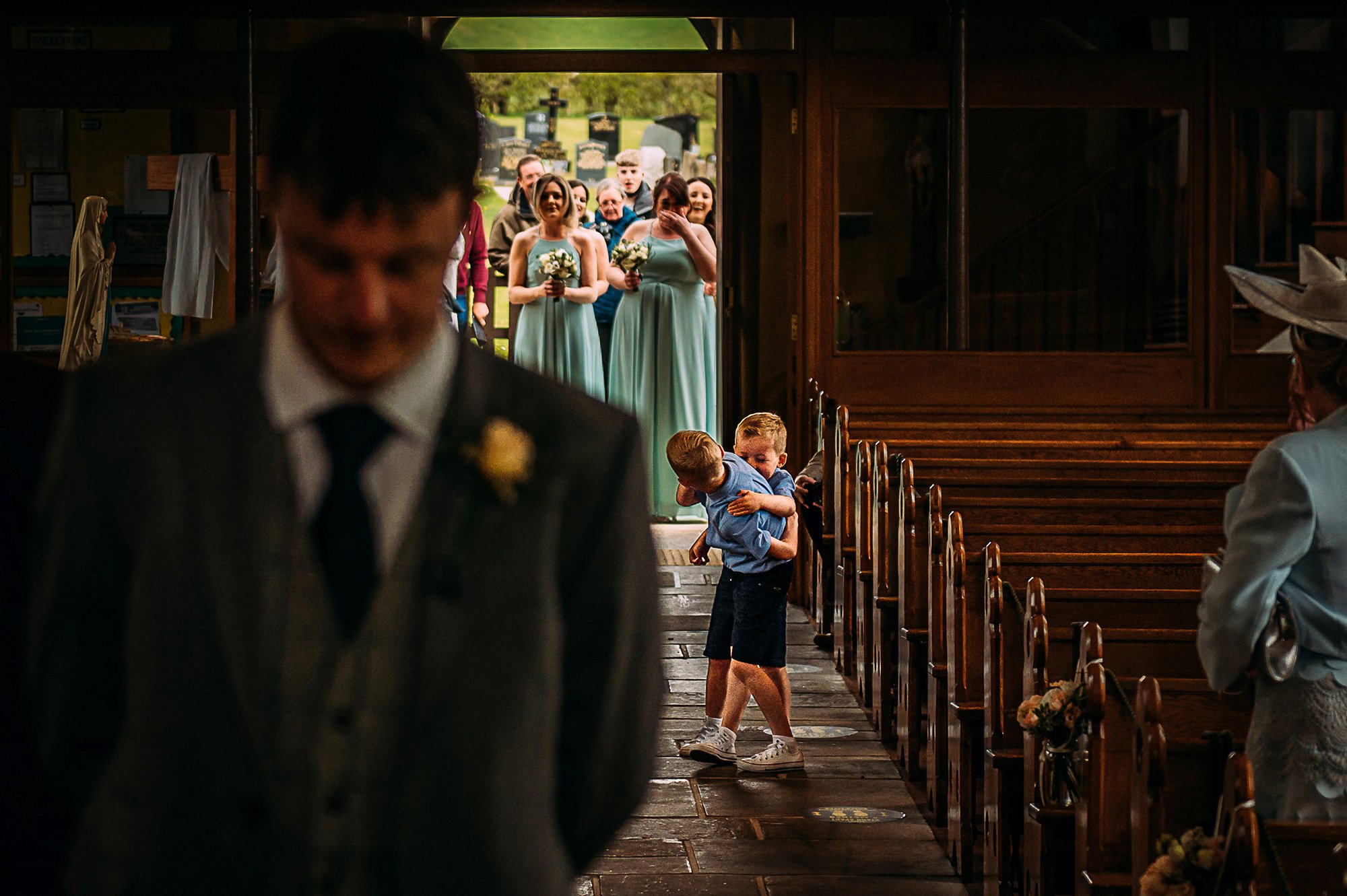  Two page boys fighting as they come down the aisle. 