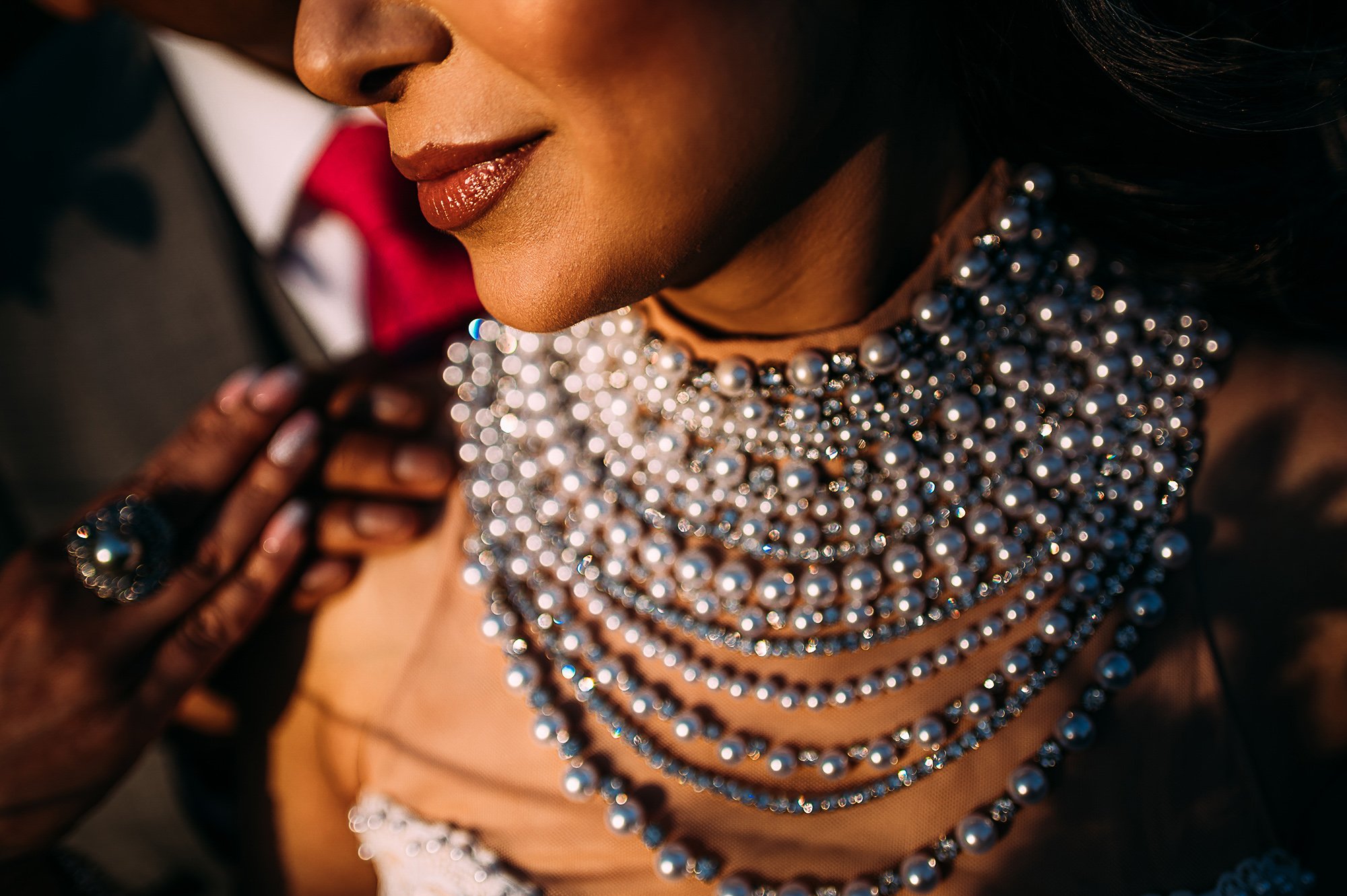  Close up of brides neck wear and lips. 