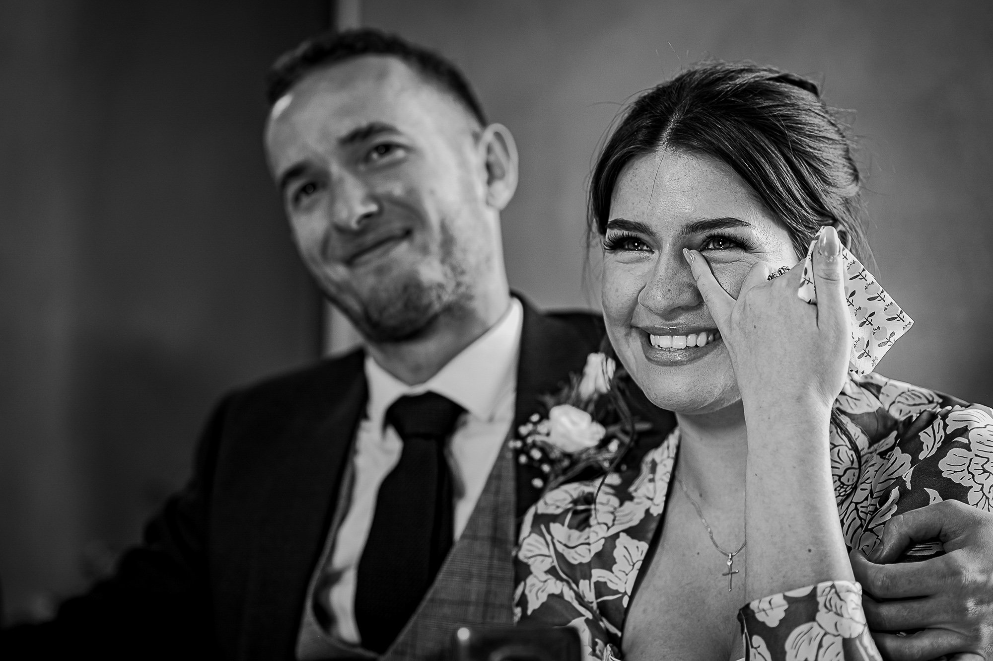  Girl wiping happy tears during the speeches. 