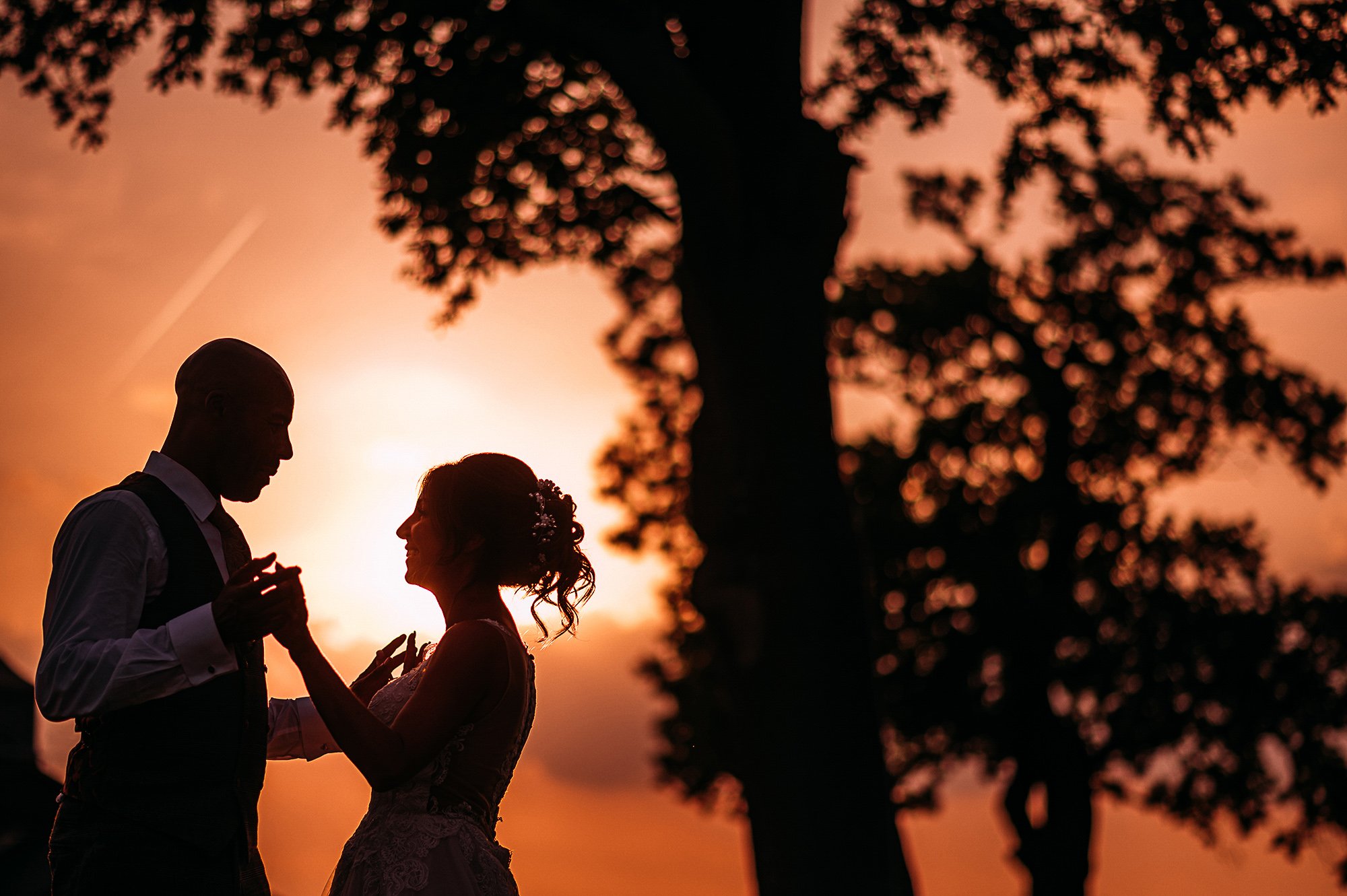  Bride and groom sunset silhouette. 