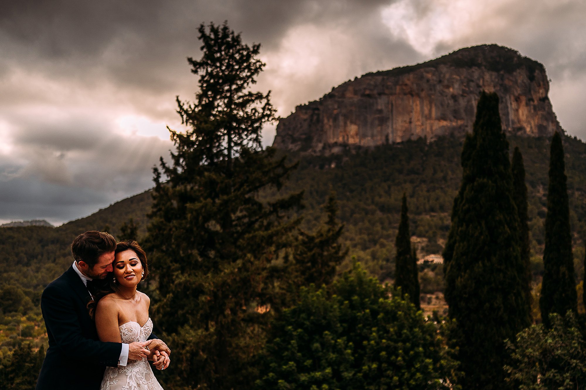  Bride and groom in front of the stunning hills in Mallorca. 