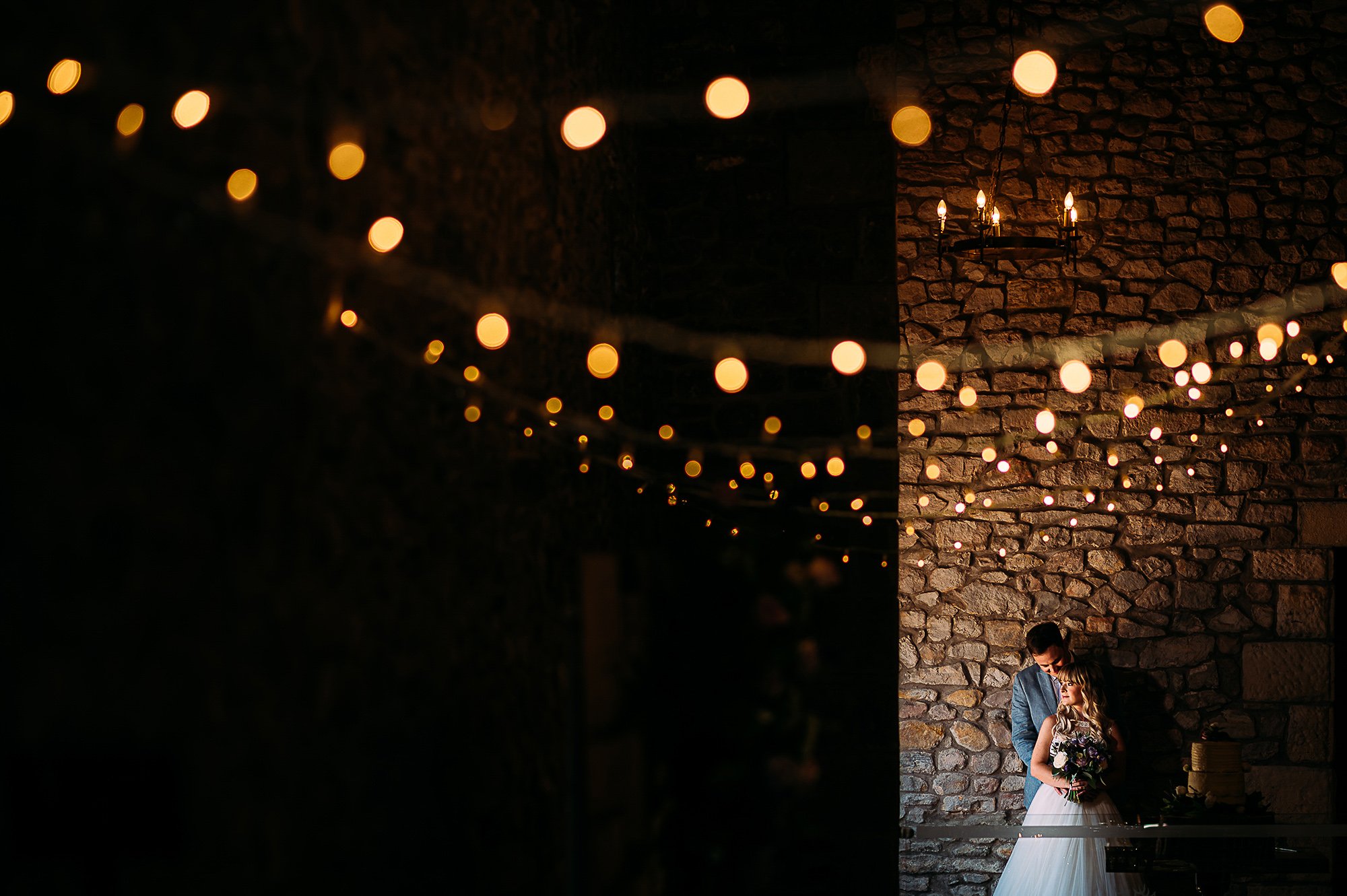  Bride and groom under fairy lights at Browsholme hall. 