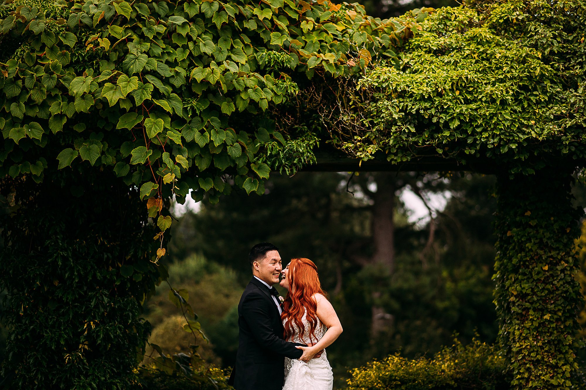  Couple shot at Thornton Manor. Red hair stands out from the green trees. 