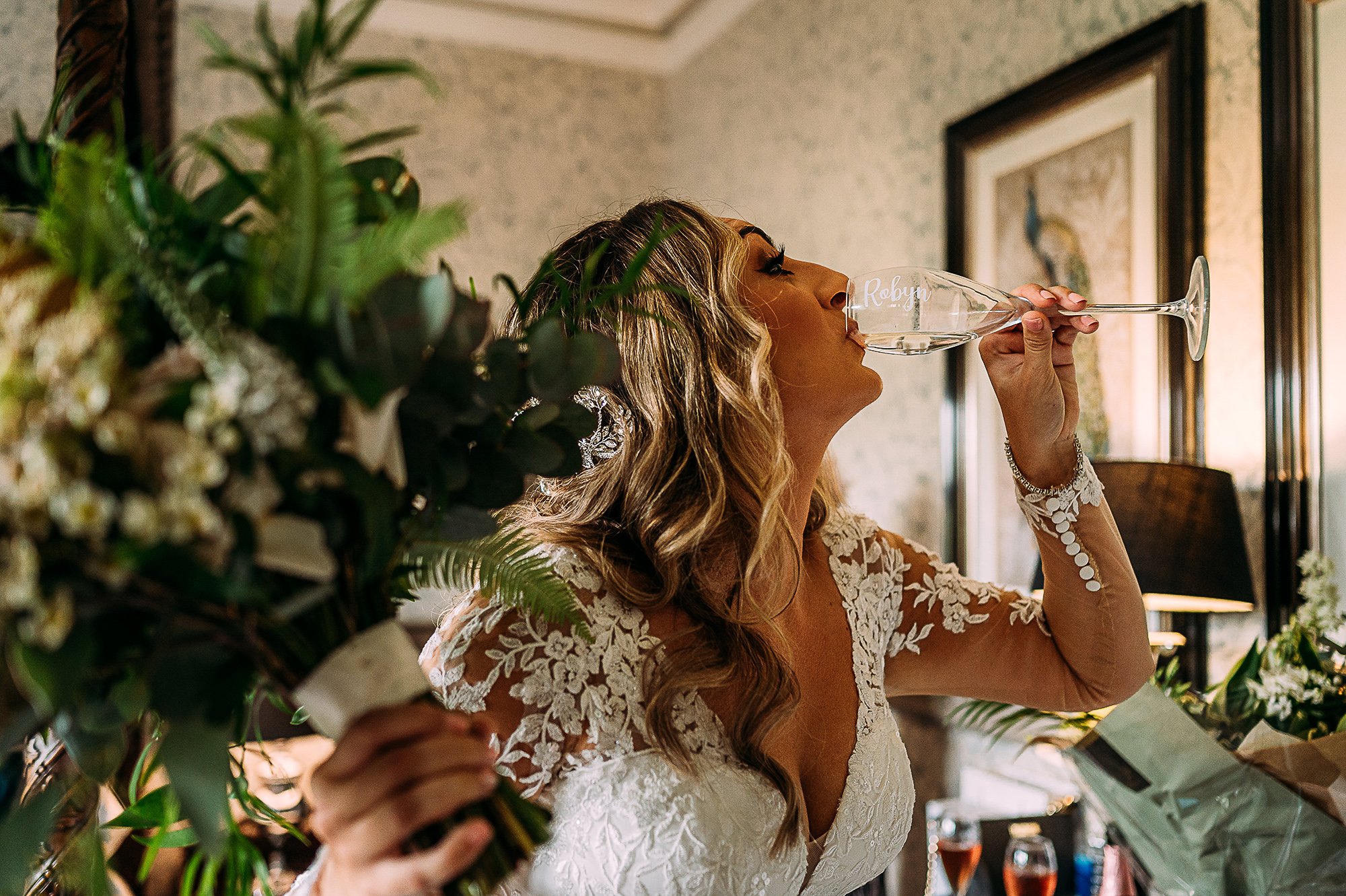  Bride quickly downing her champagne before rushing to the ceremony. 