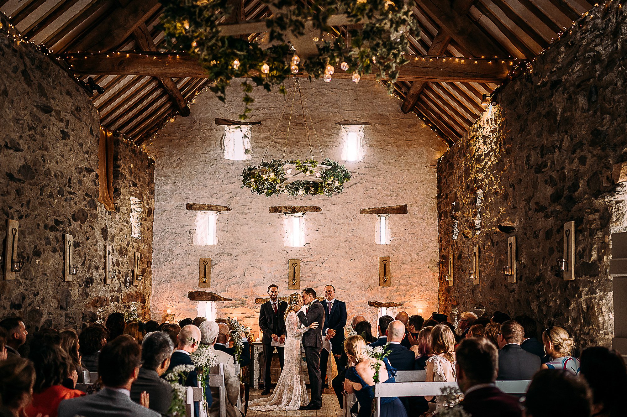  Bride and Groom’s first kiss in a beautiful Welsh barn. 