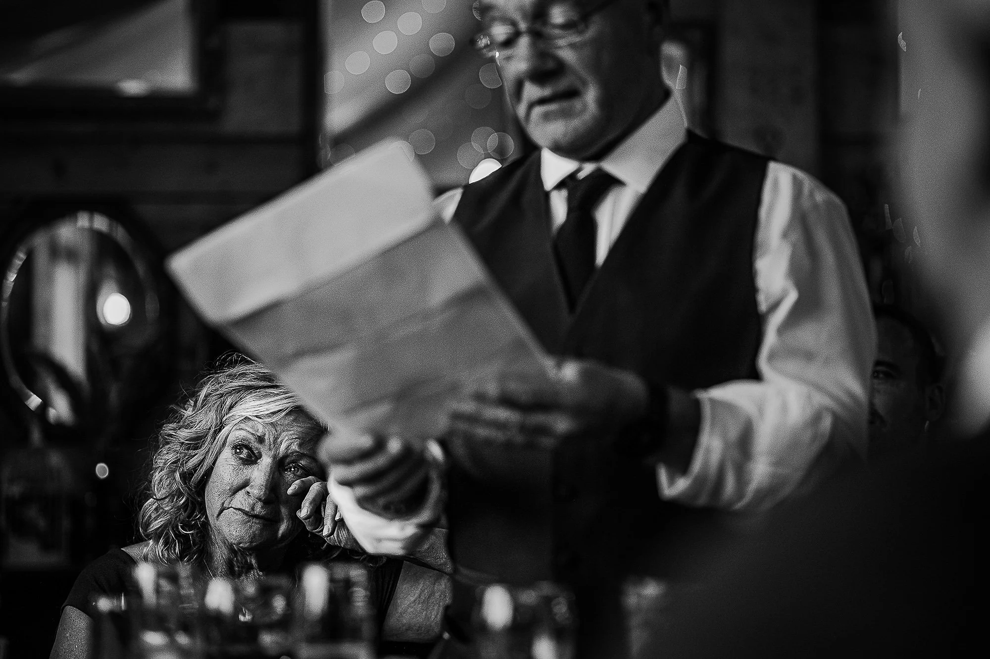 Mother of the bride looking emotional during her husbands speech.