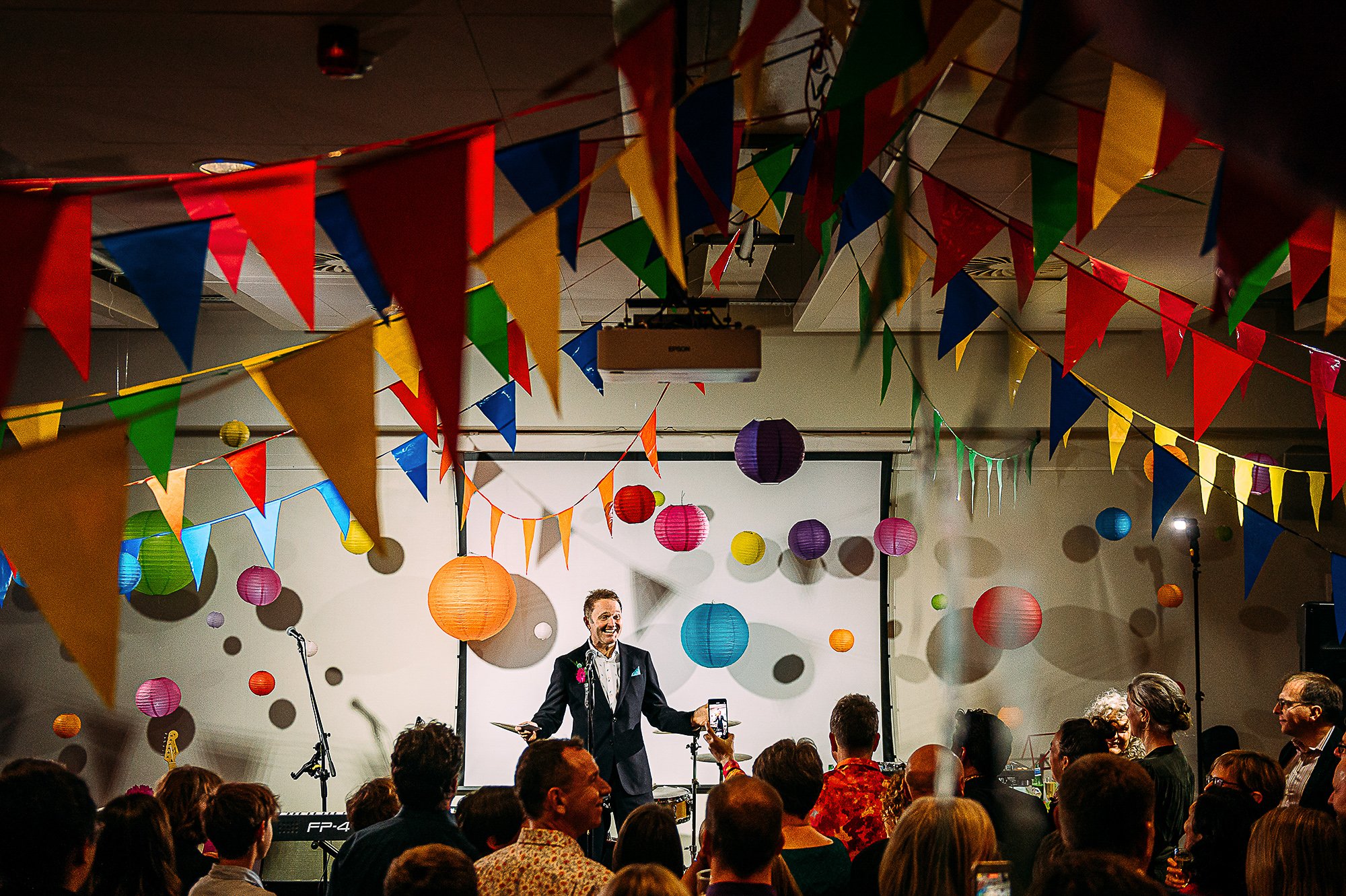  Groom speech in a room filled with flags and balloons. 