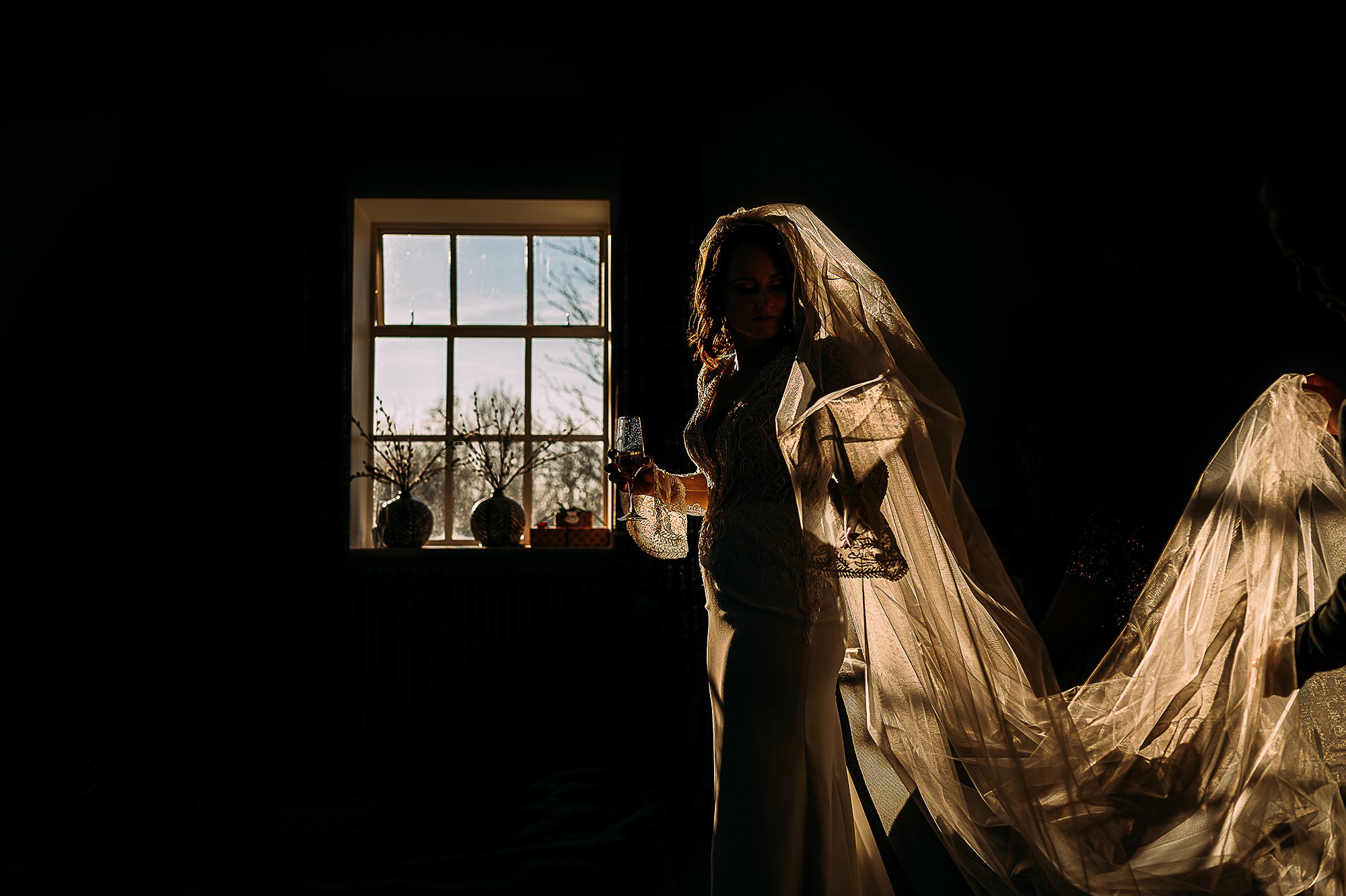  Bride having veil put on in incredible light. 